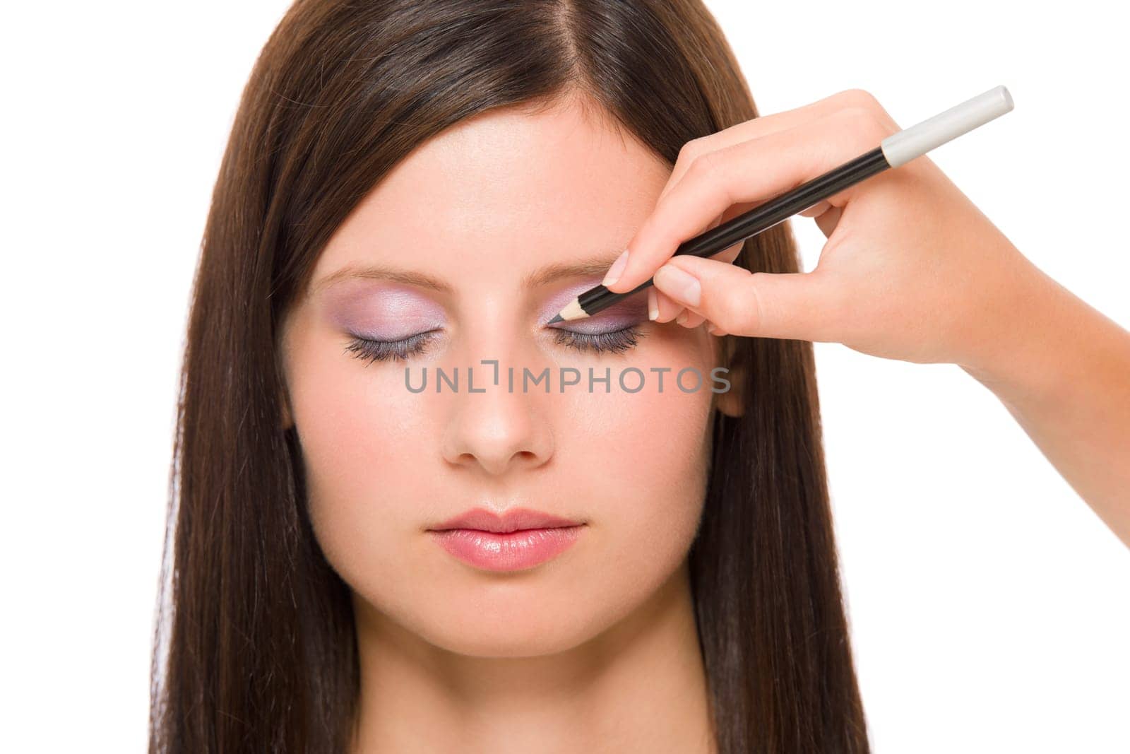 Professional makeup model portrait artist make eye lines using pencil