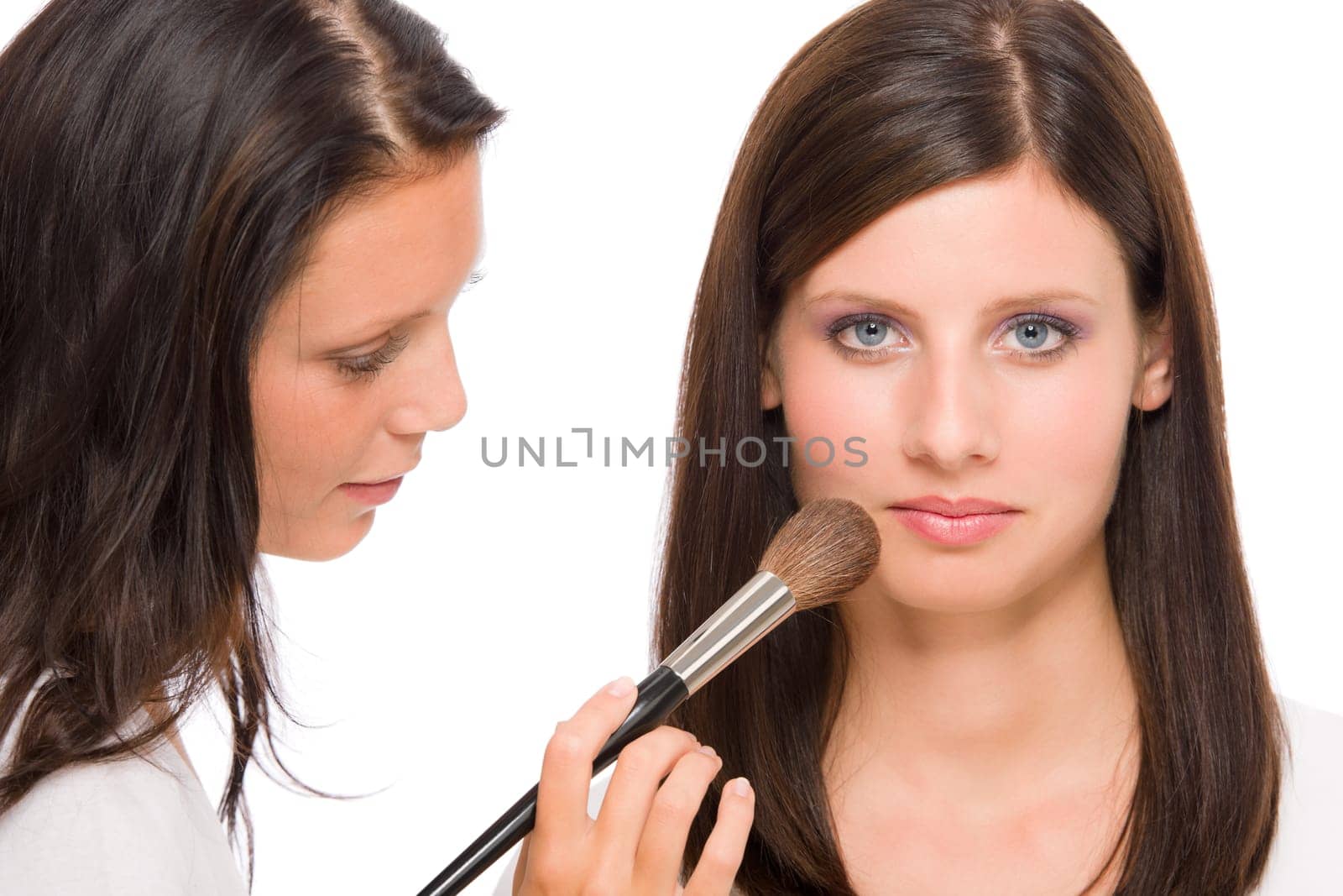 Make-up artist woman fashion model apply powder blush rouge brush
