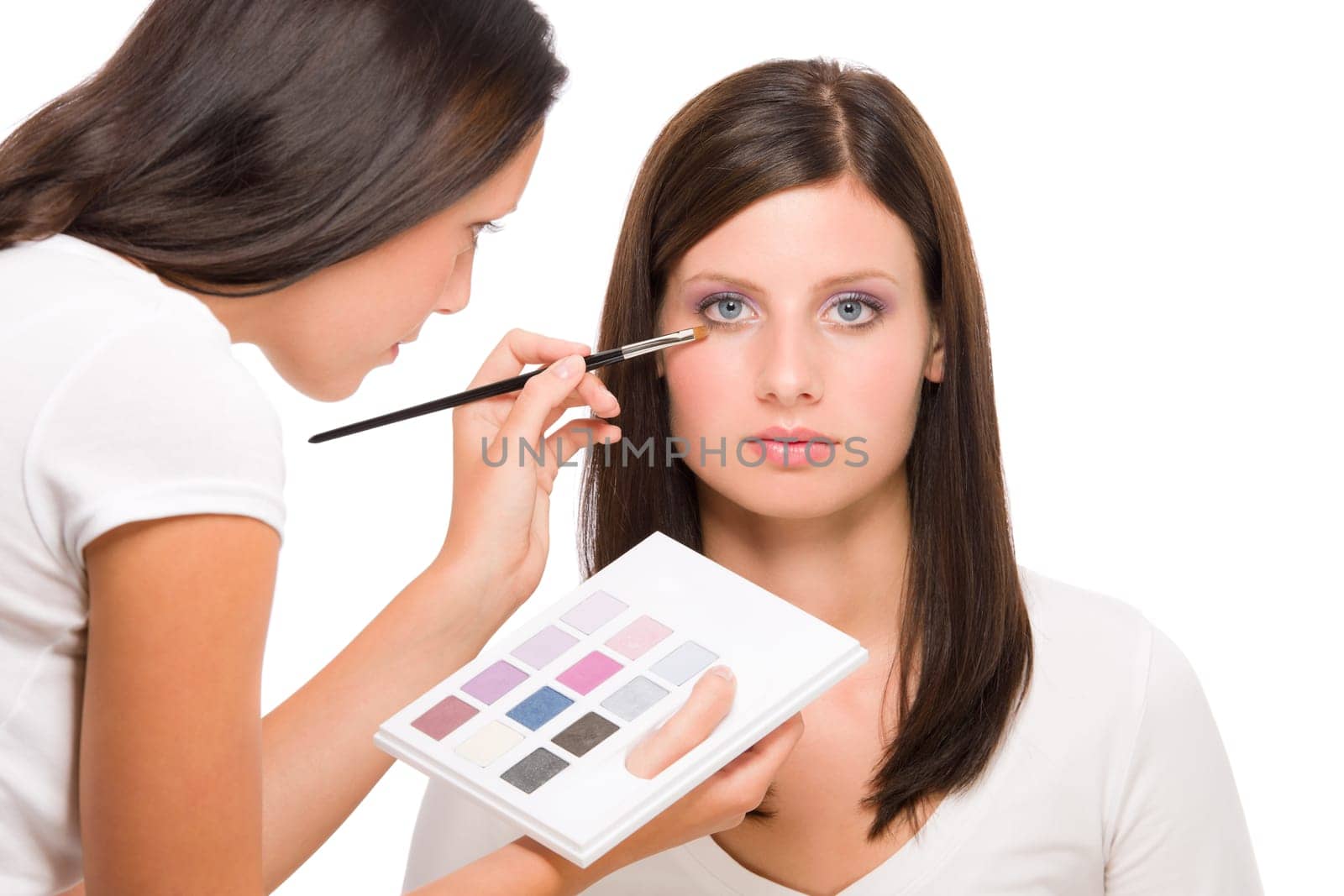 Make-up artist woman fashion model apply eyeshadow from color palette