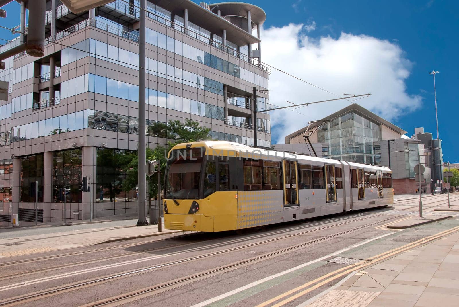 A Modern Yellow Tram on an English City Street