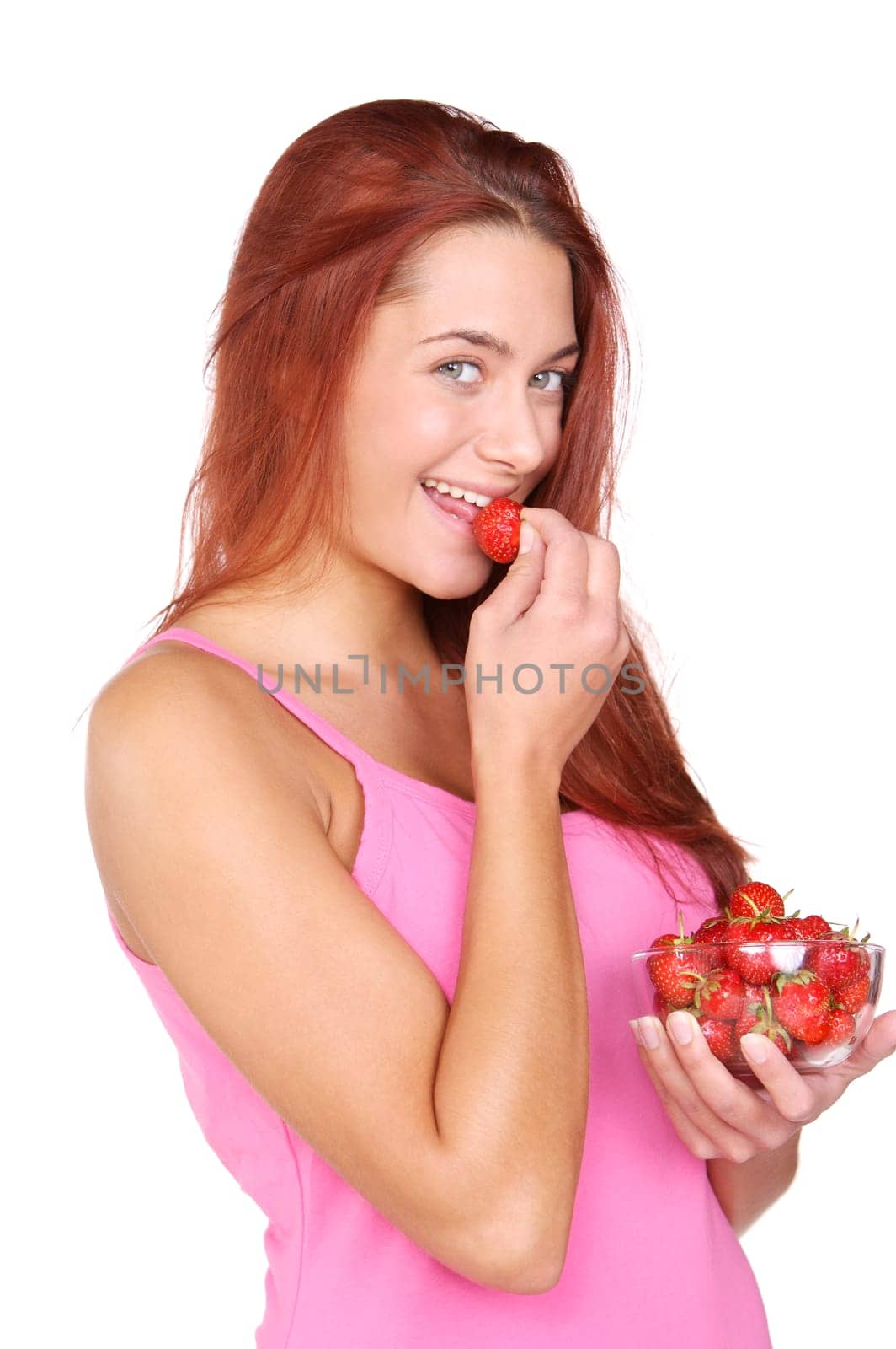 Young woman eating strawberries