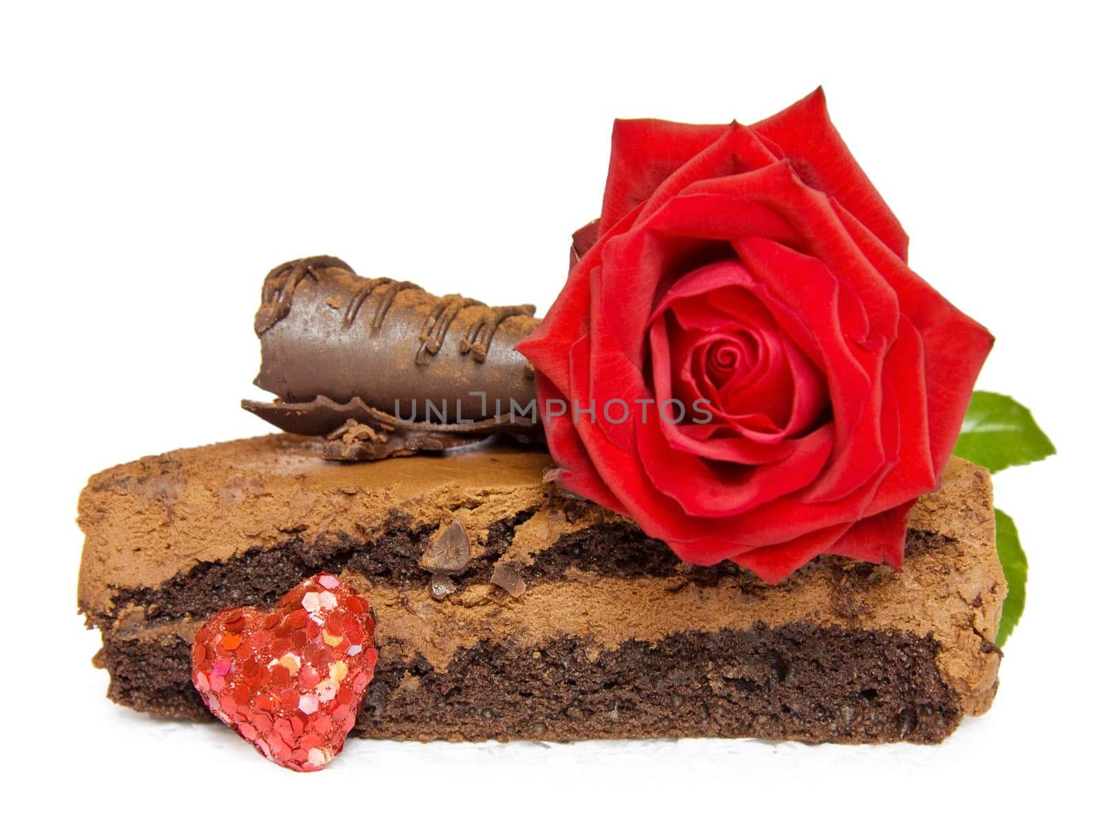 Birthdays, Valentines and anniversaries - festive cake with red rose and sparkling heart. Isolated over white background.