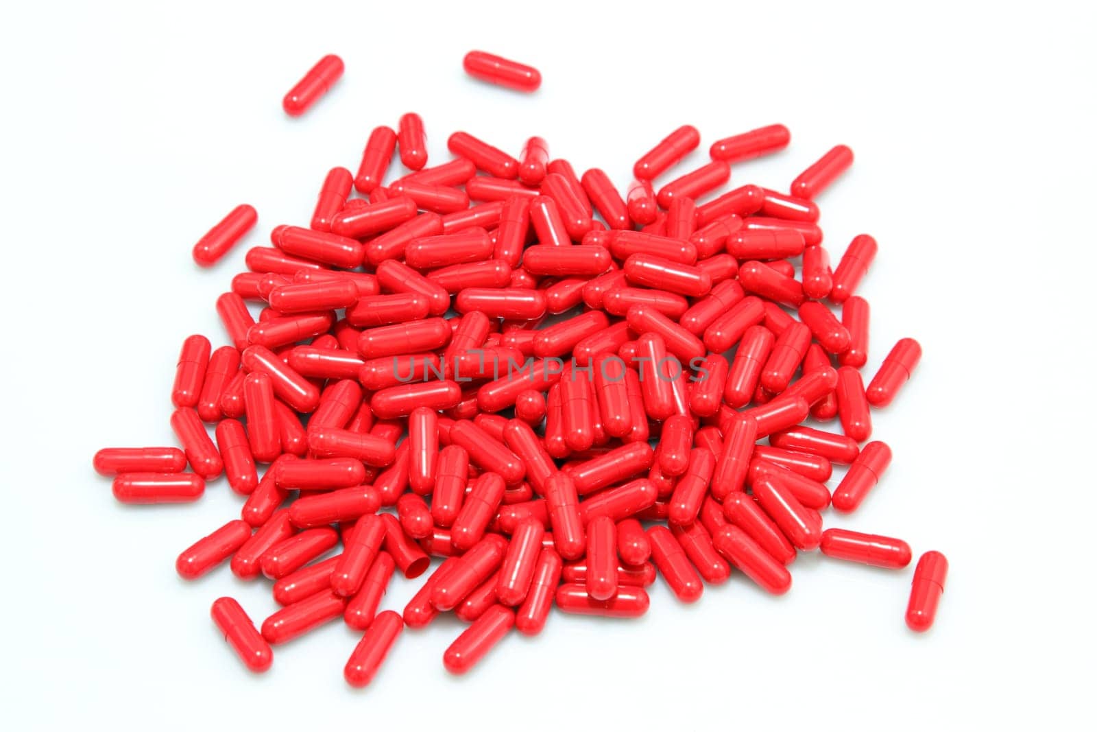 details of red pills isolated on white