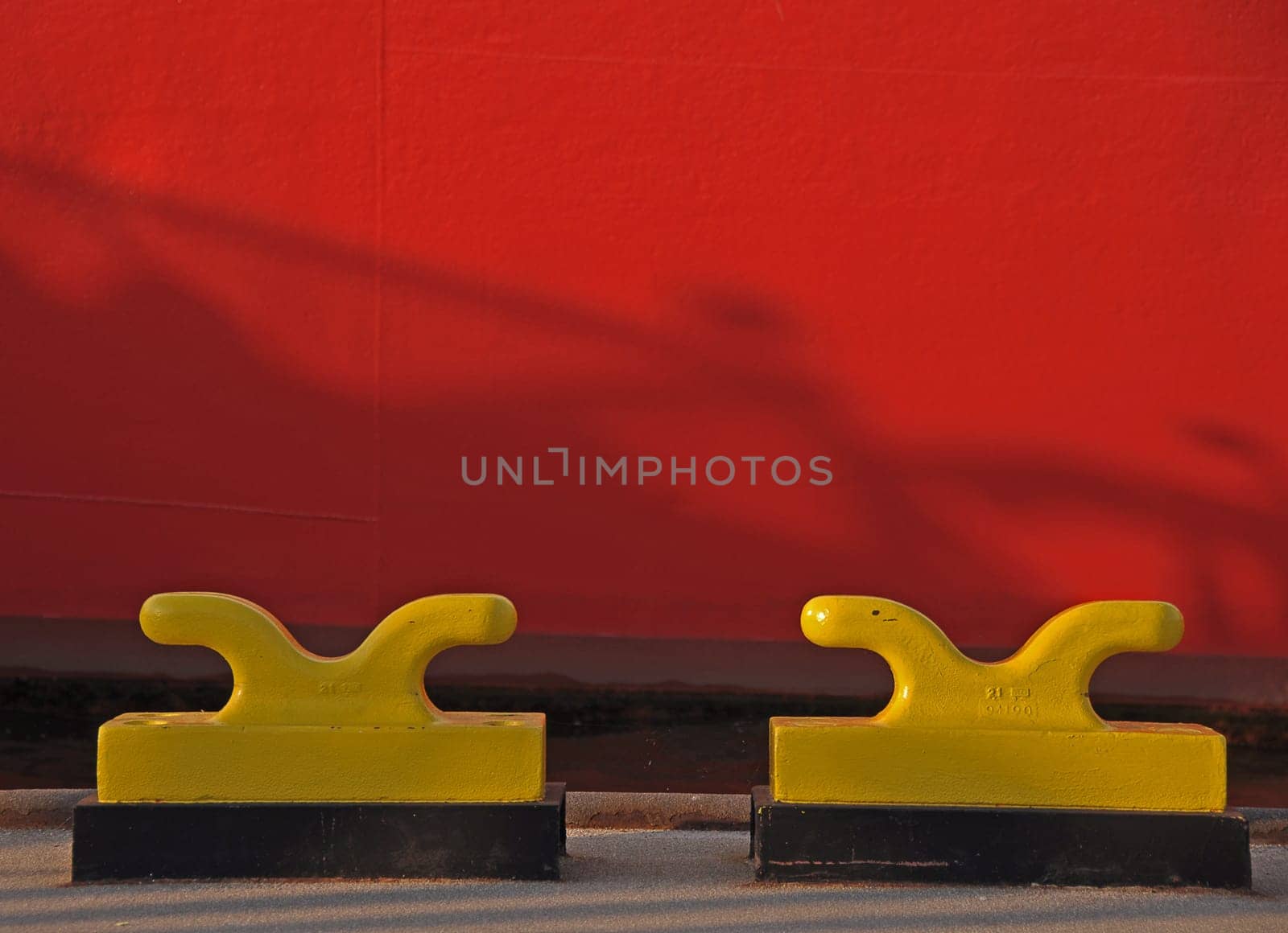 two yellow bollards