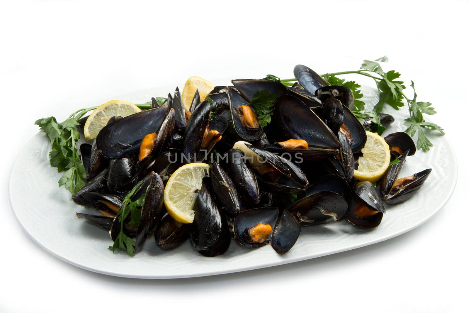 pile of cooked mussels  over white background