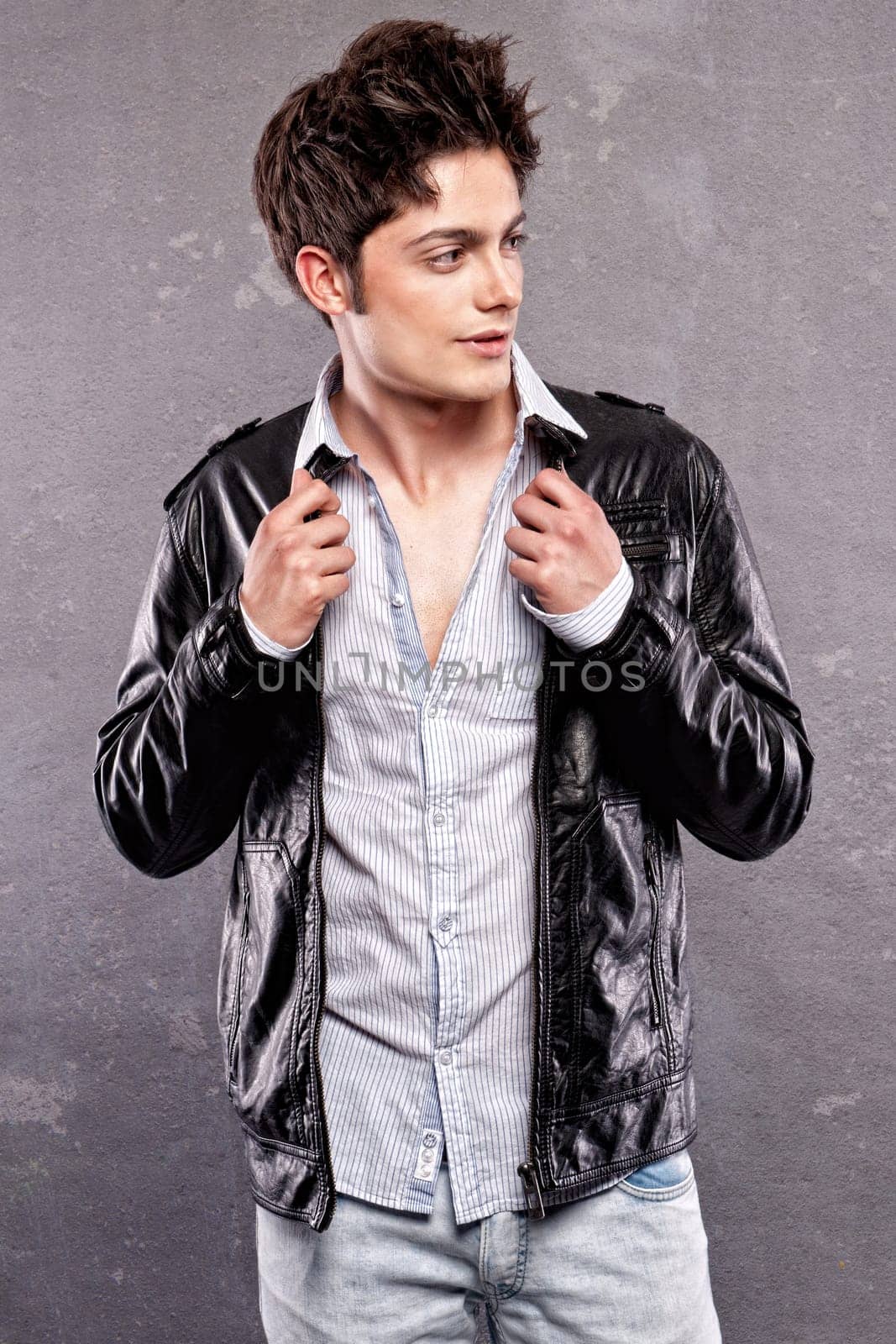 Fashion shot of a young man in the studio