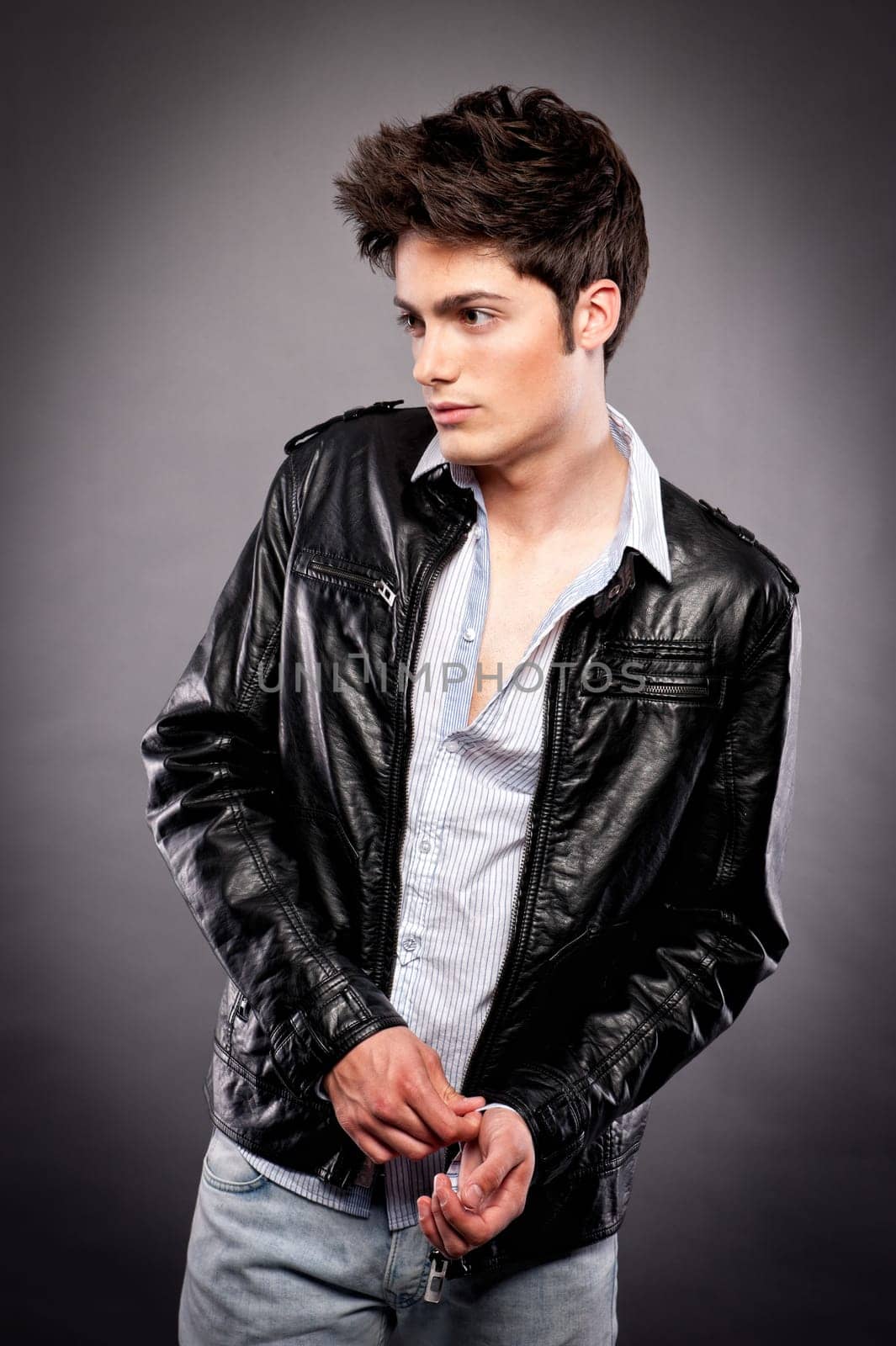 Fashion shot of a young man in the studio