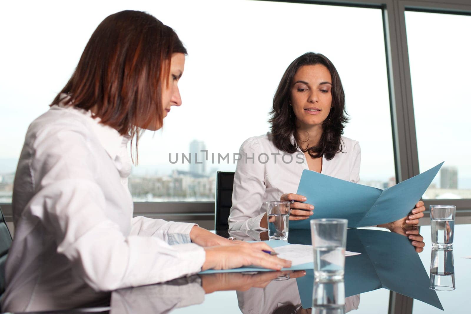 Going through business files in the conference room