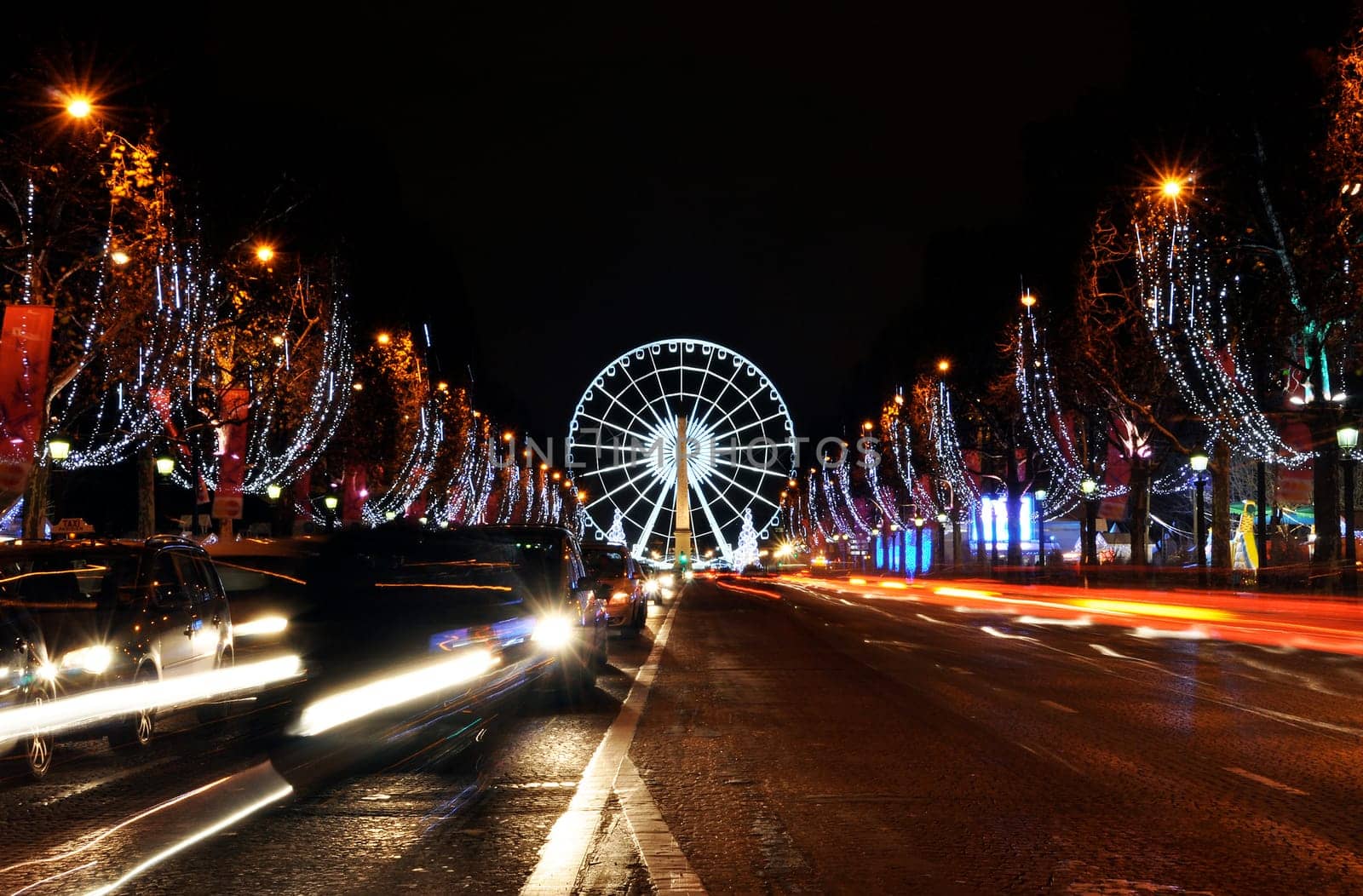 The Champs-Elysees avenue and the ferris wheel on Concorde Square illuminated for Christmas