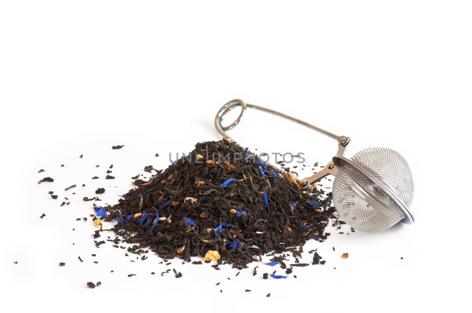 Scented tea and tea ball on white background