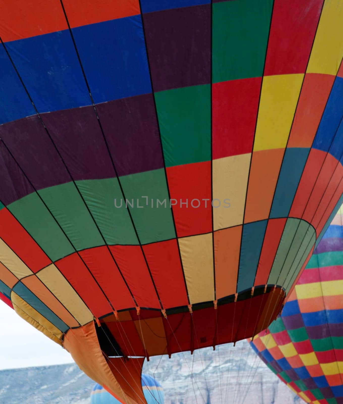 Two on the ground hot air balloons texture, vertical, multi colors and crop space