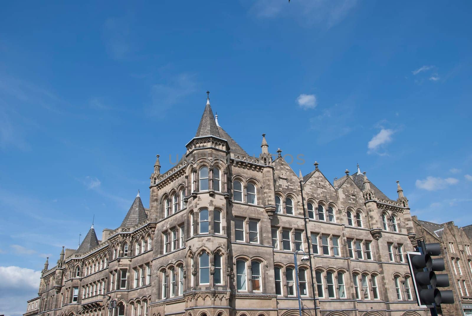 A Vintage Stone Built Office Block under a blue sky