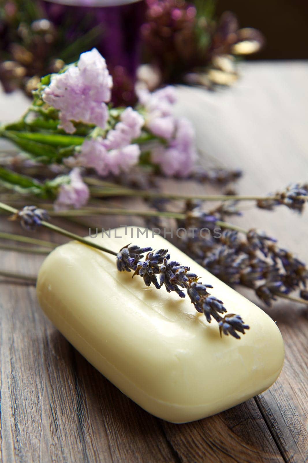 lanvander soap with flower on wooden background
