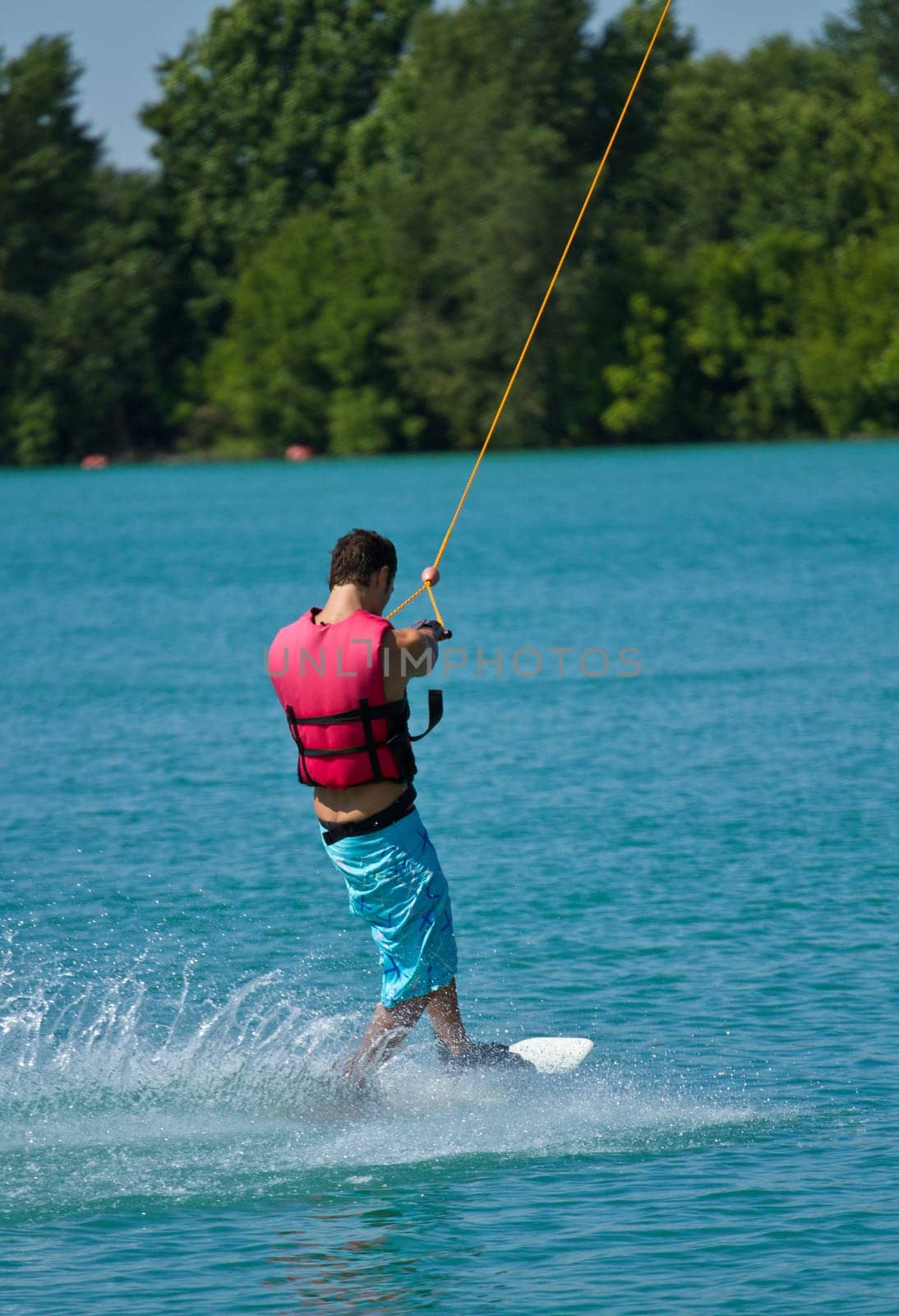 Man water skiing on a lake
