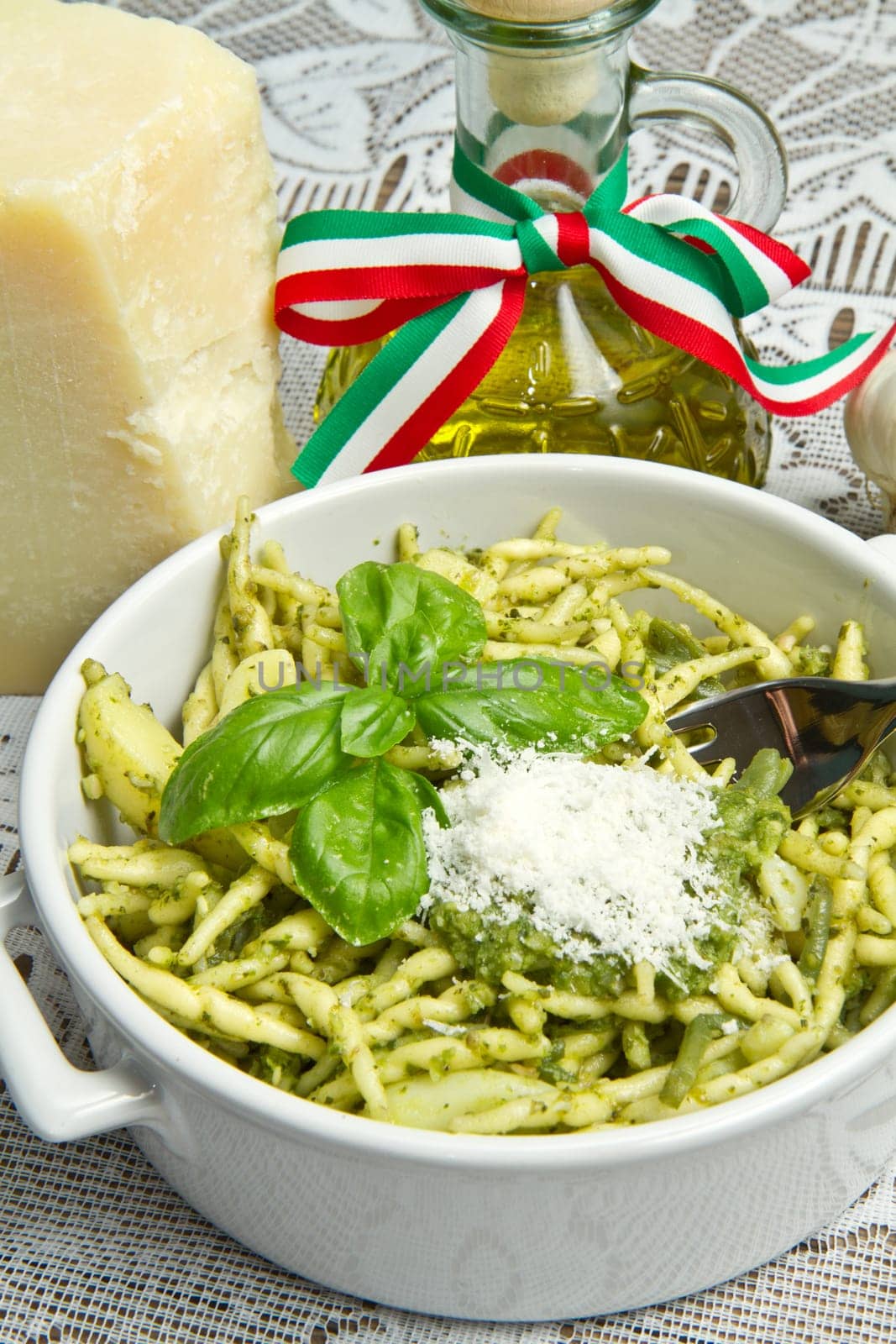 pasta with pesto on white plate
