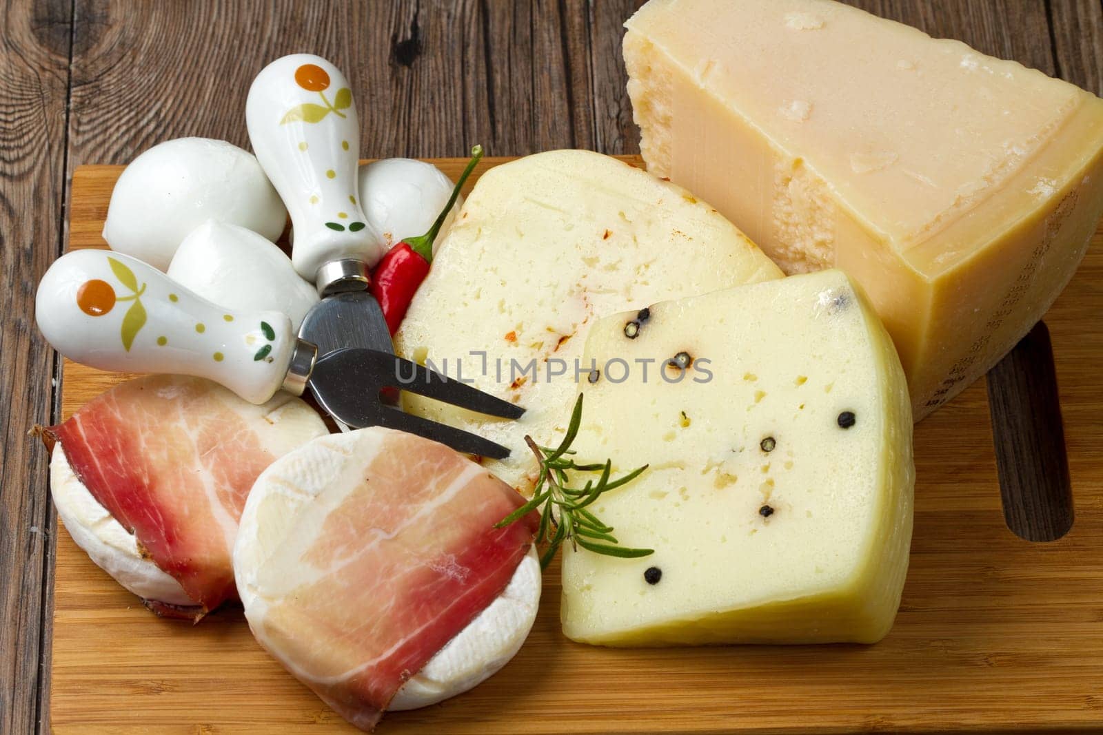 mixed cheese on wood table