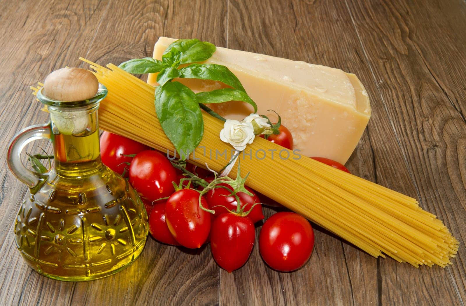 spaghetti ingredients with fresh tomatoes, basil and parmesan cheese