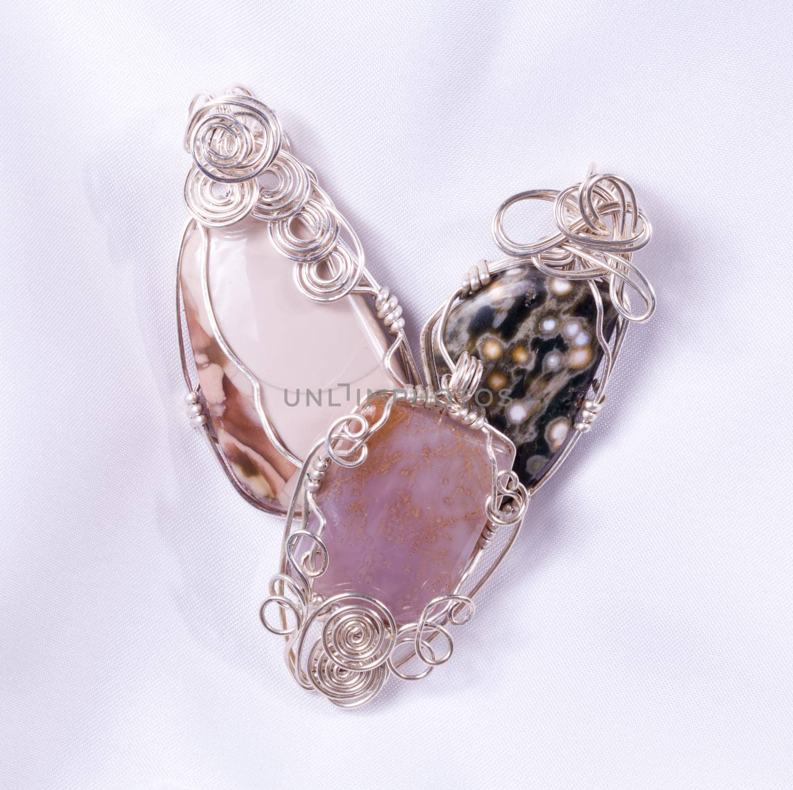 Pendants or cabochon stones wire wrapped in silver wire