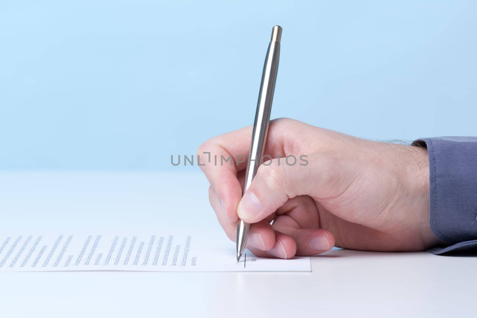 Signing a contract - hand with pen