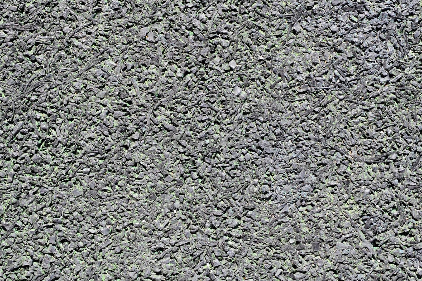 Rubberized floor texture. A type of sustainable flooring that can be produced from recycled tires.