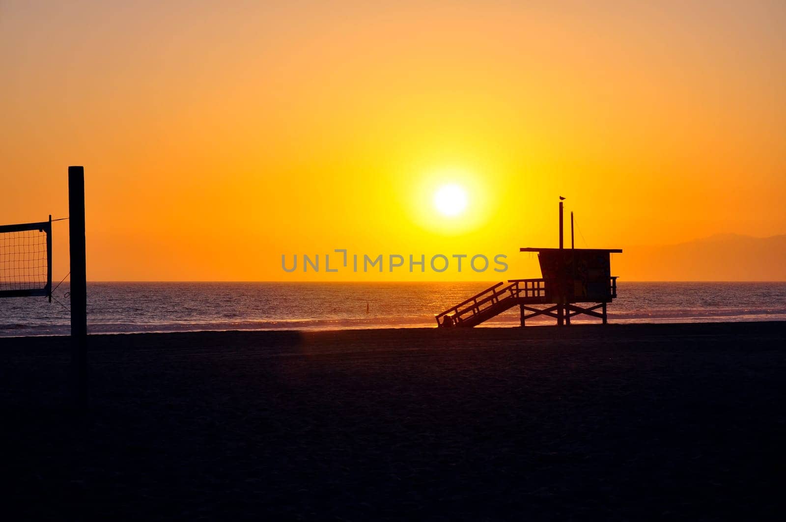 Lifeguard tower with sunset