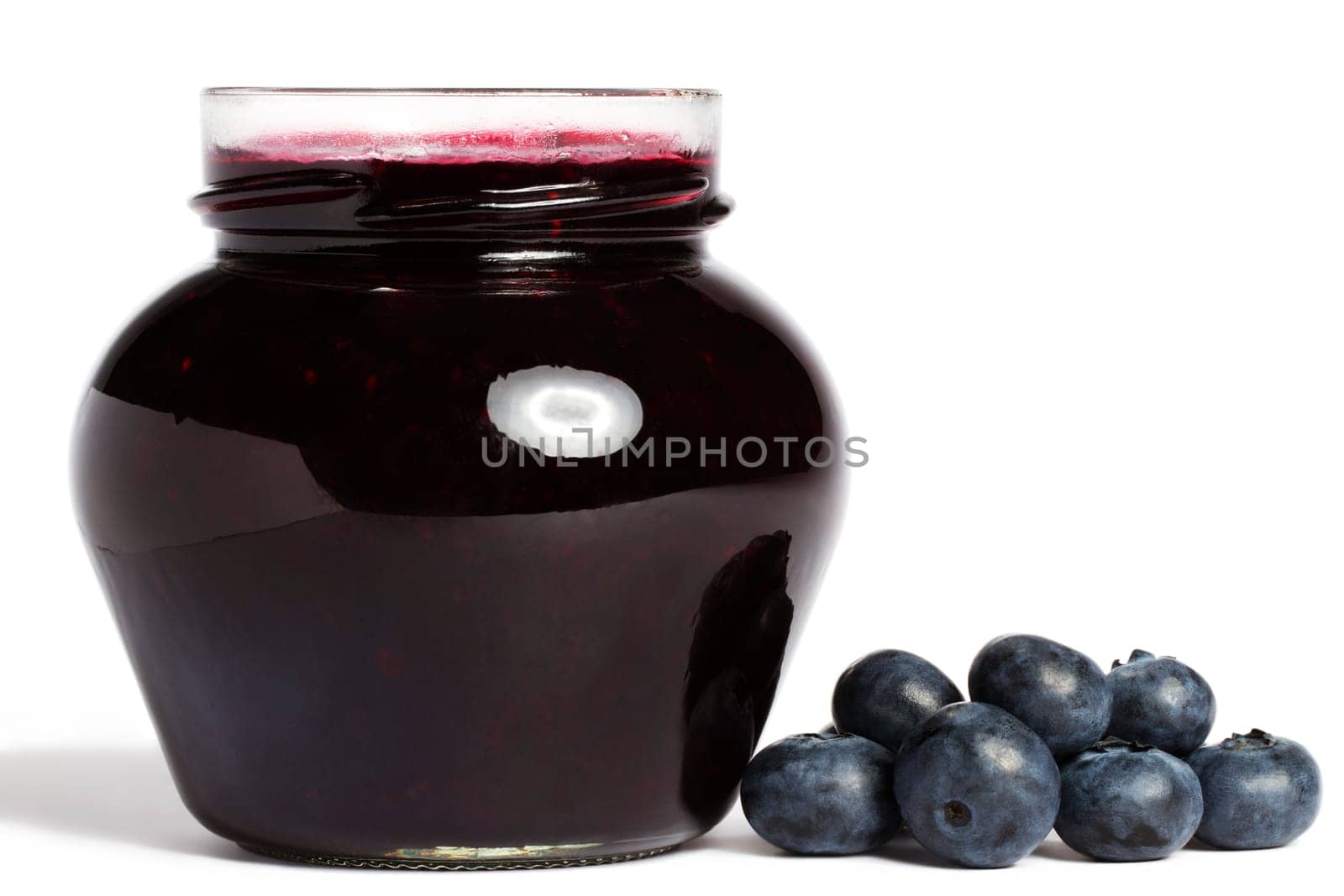 Jam jar with blueberries on white background