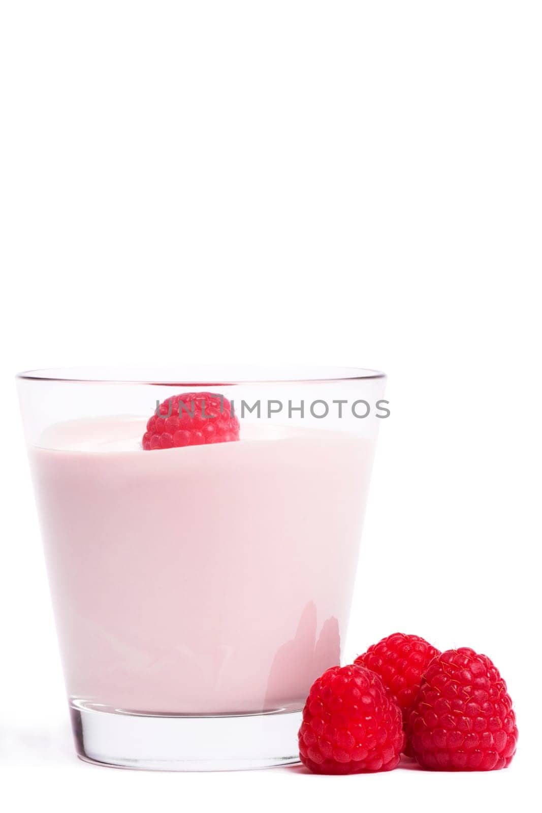 Milkshake with raspberries on white background