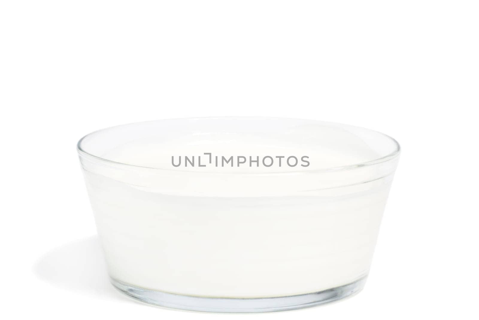 Yogurt in a bowl on white background