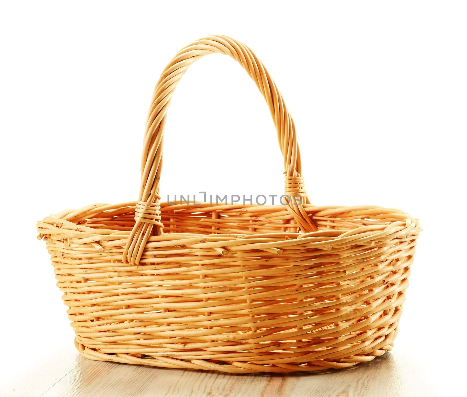 Empty wicker basket isolated on white