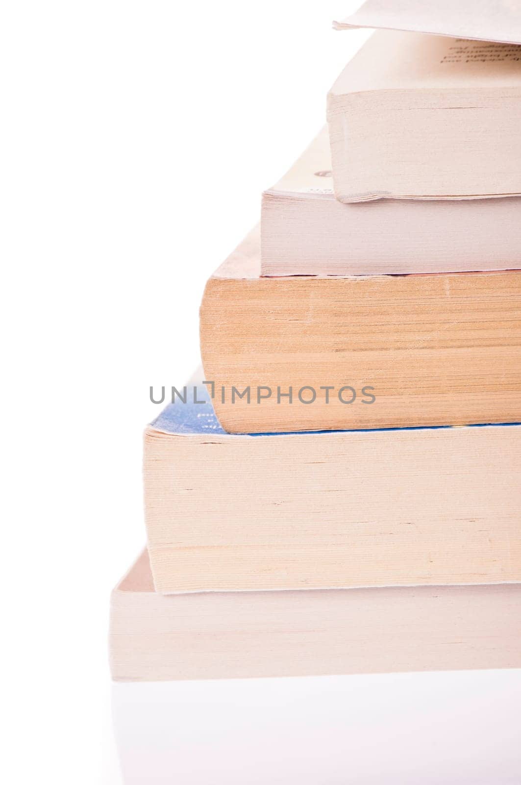 Stack of five, old discoloured books, isolated on white backgroud