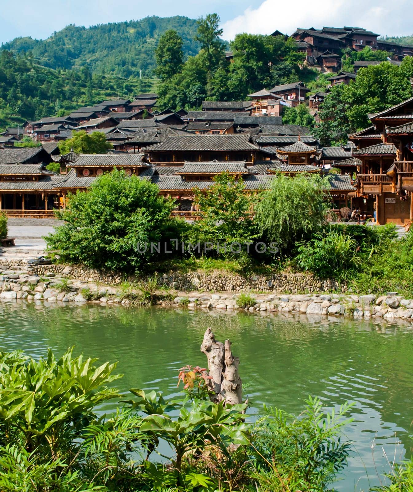Ethnic Chinese Miao village near a river in rural China