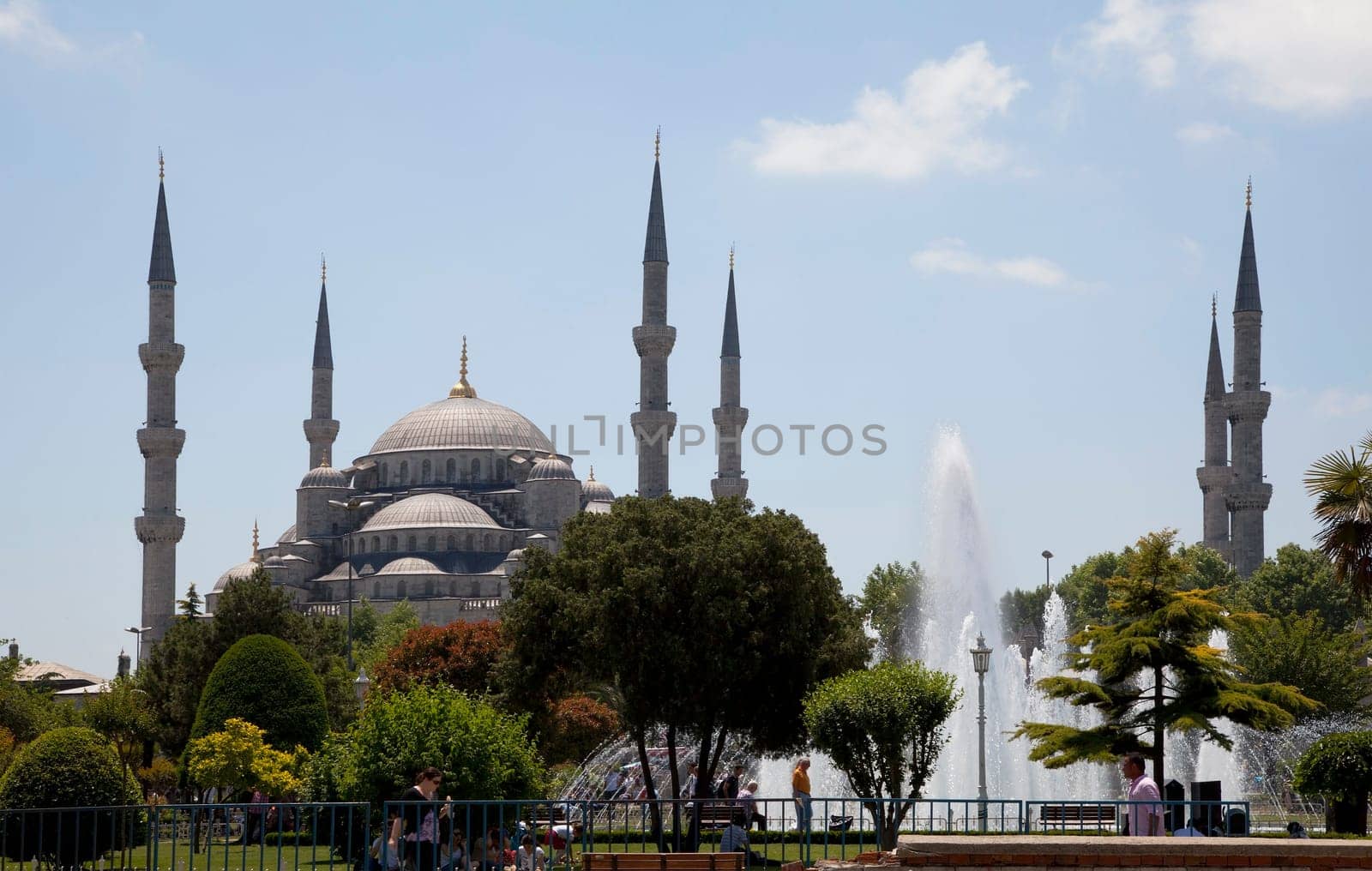 Istanbul, Turkey: June 2011 - The Blue Mosgue its gardens and fountains with public relaxing in its park and gardens