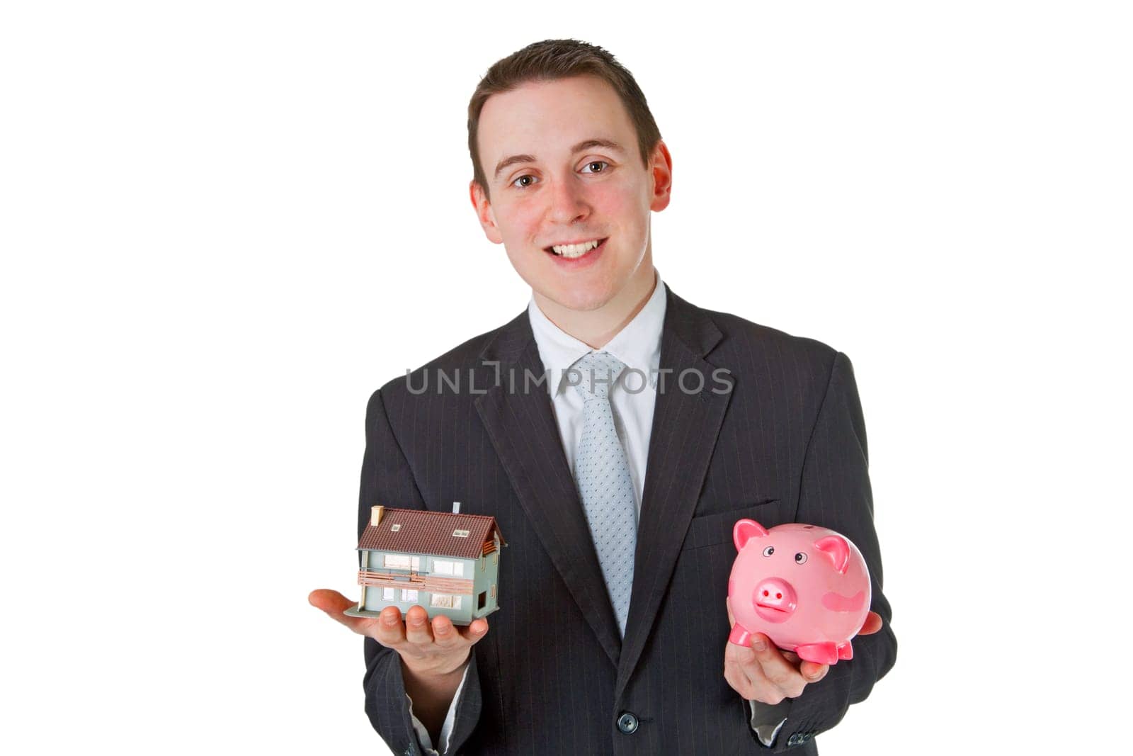 Friendly businessman presenting model house - isolated on white background