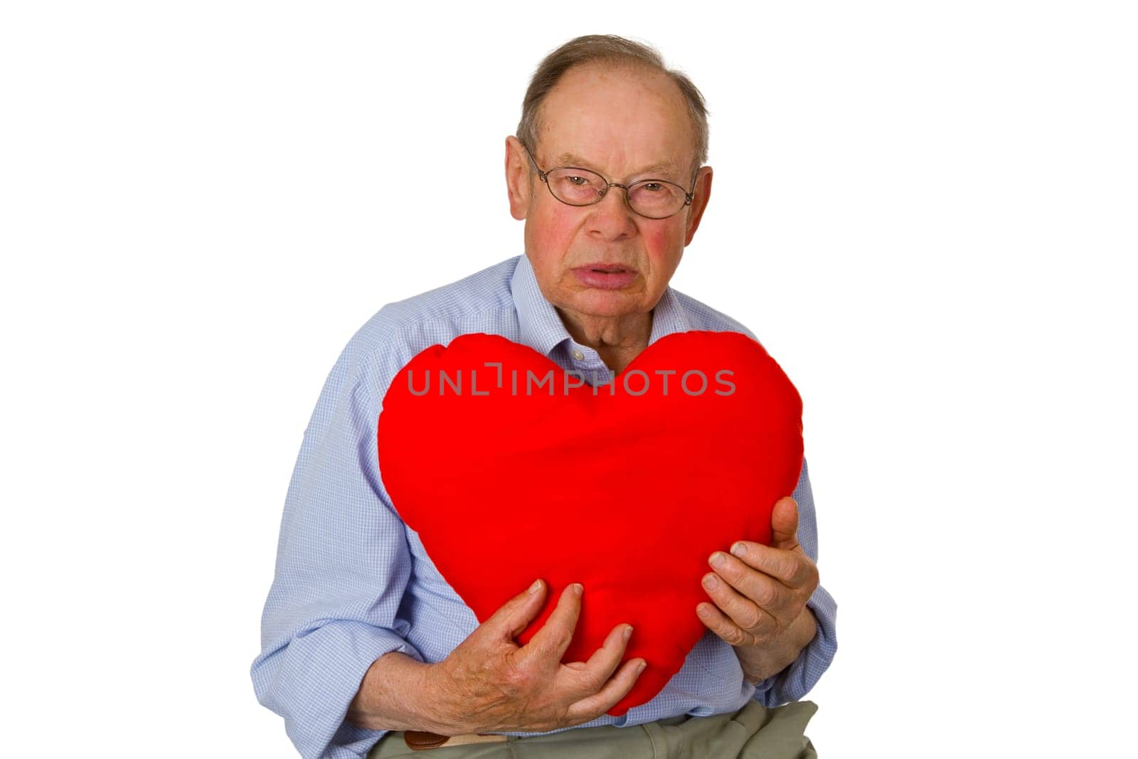 Senior with red cloth heart - isolated on white background