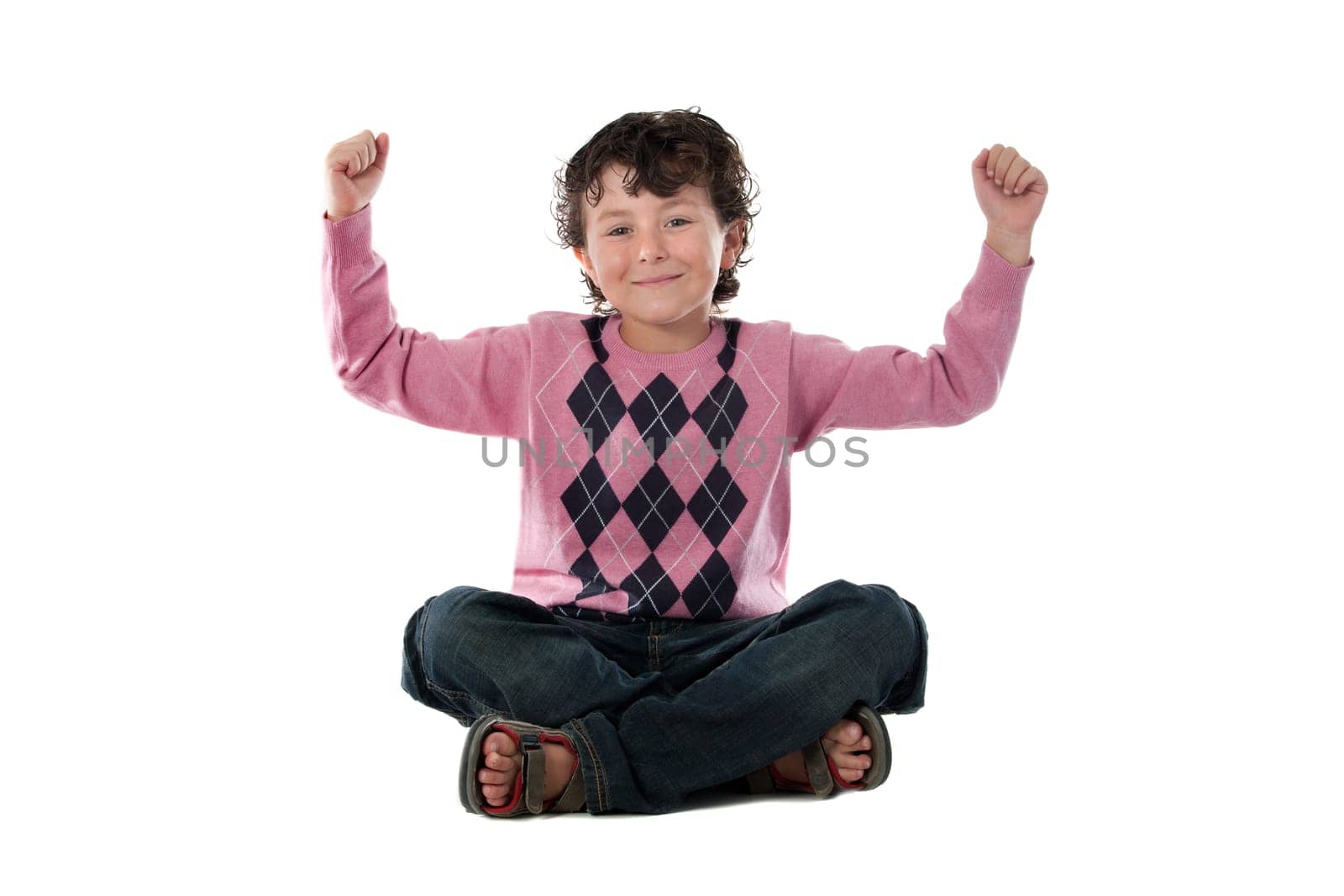 Happy child winner sitting on a over white background