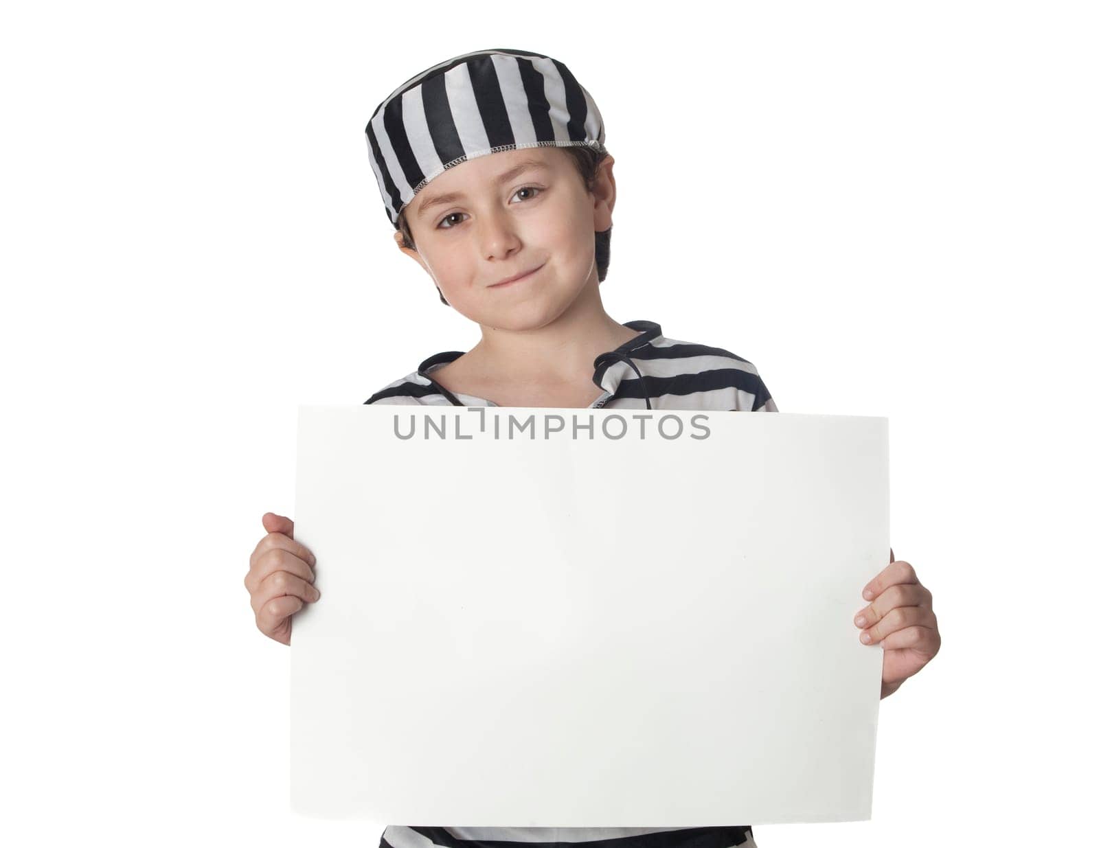 Smiled child with prisoner costume and blank poster isolated on white background