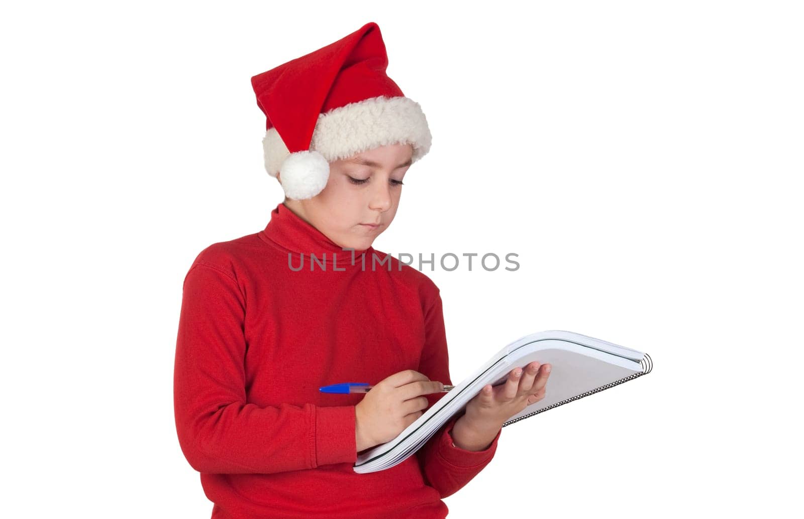 Beautiful child writing his Christmas letter to Santa Claus