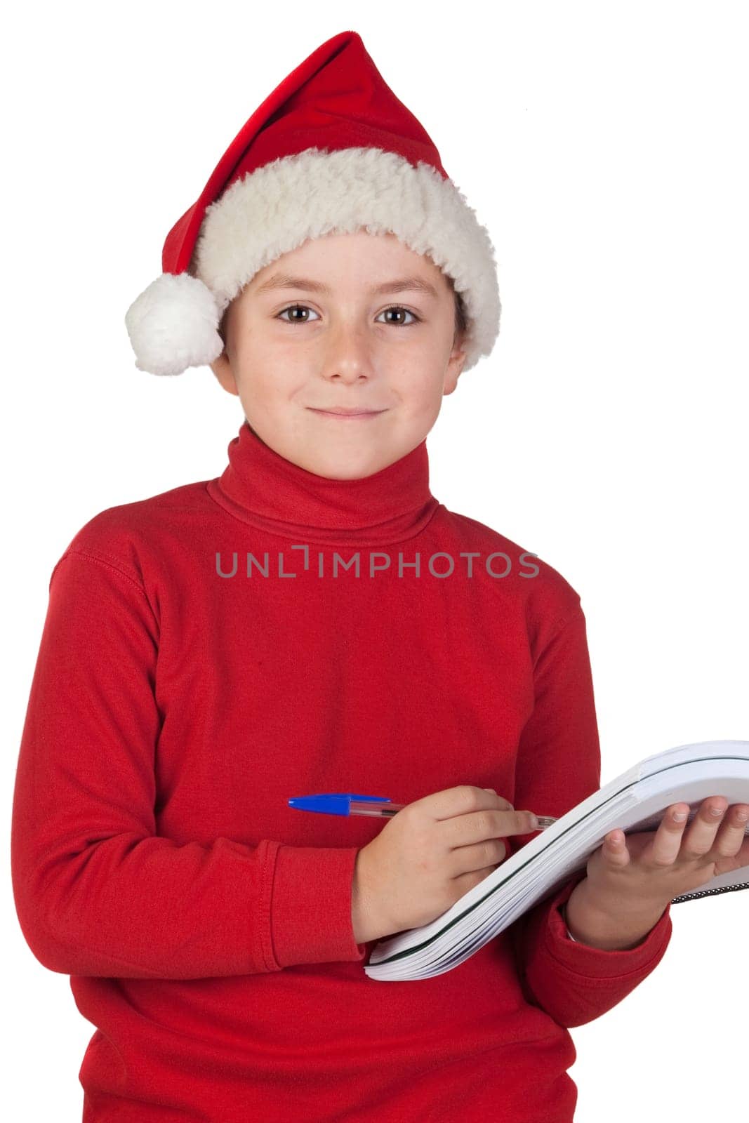 Beautiful child writing his Christmas letter to Santa Claus