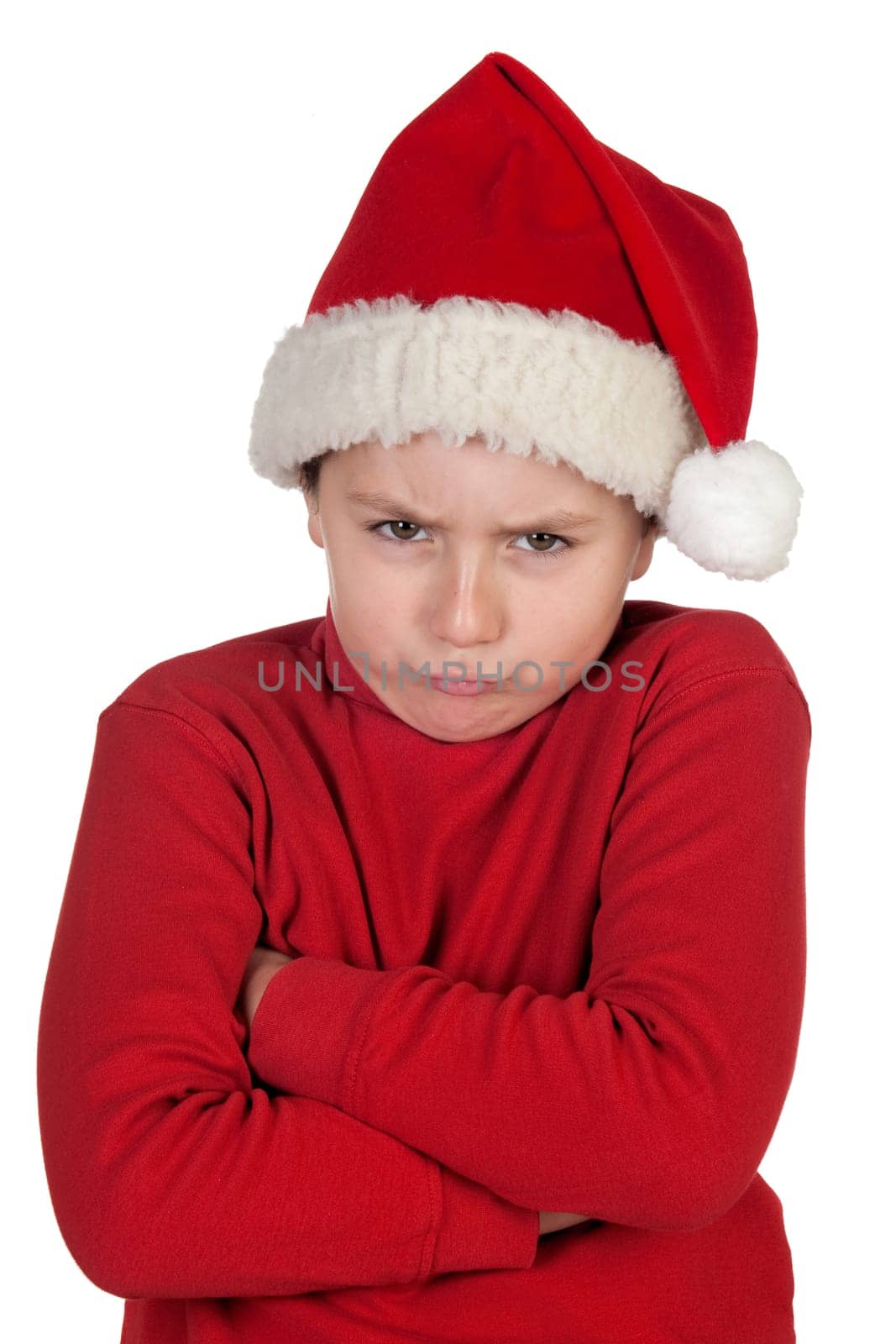 Frowning boy with santa hat isolated on white background
