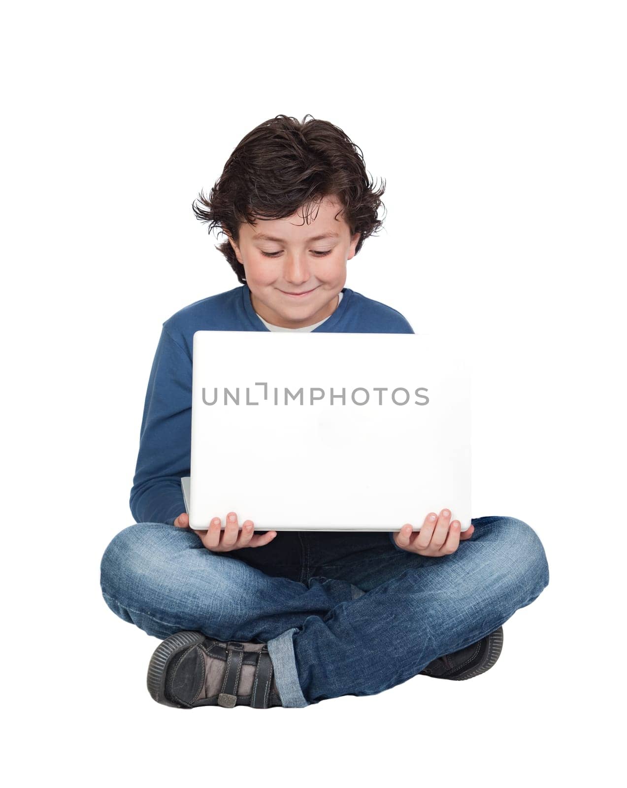 Adorable little boy sitting with laptop isolated on white.