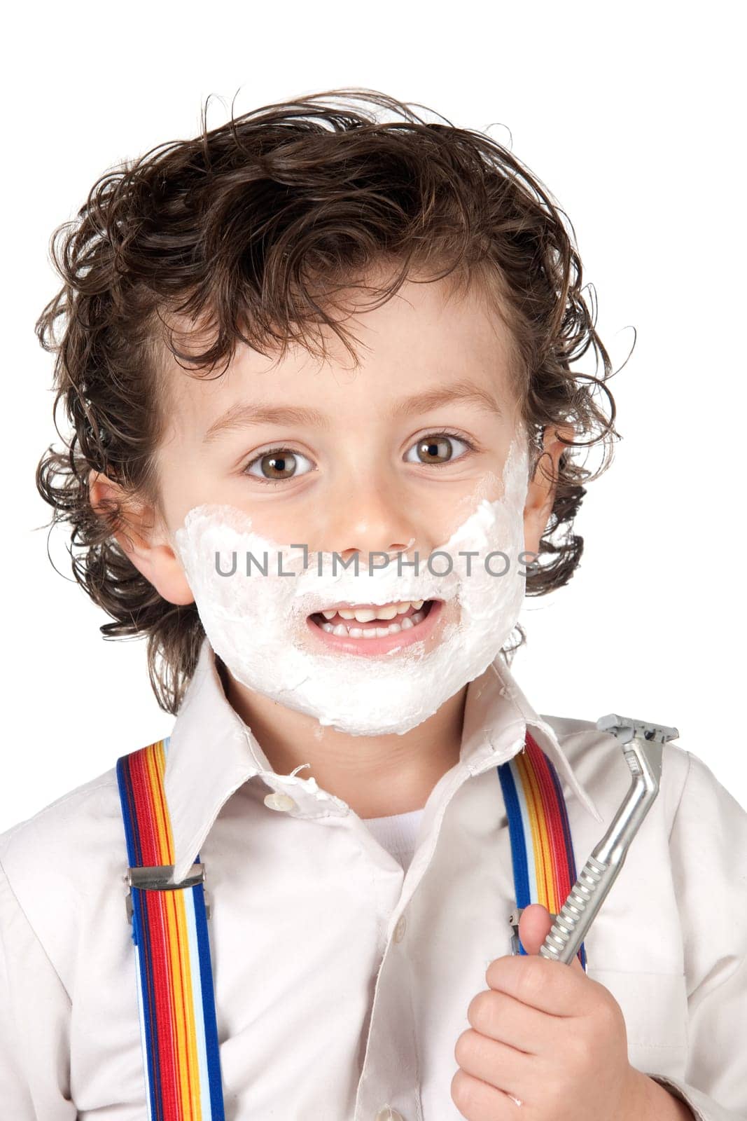 Adorable child shaving over a white background