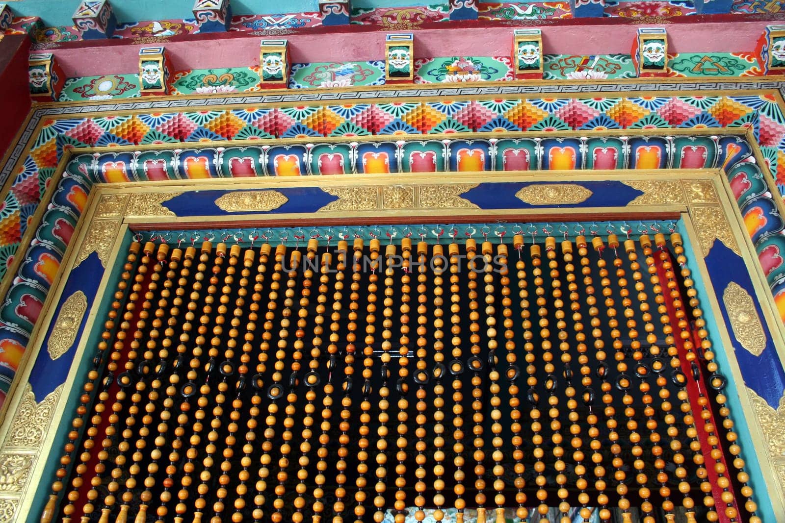 A beautifully designed door frame and beaded curtain