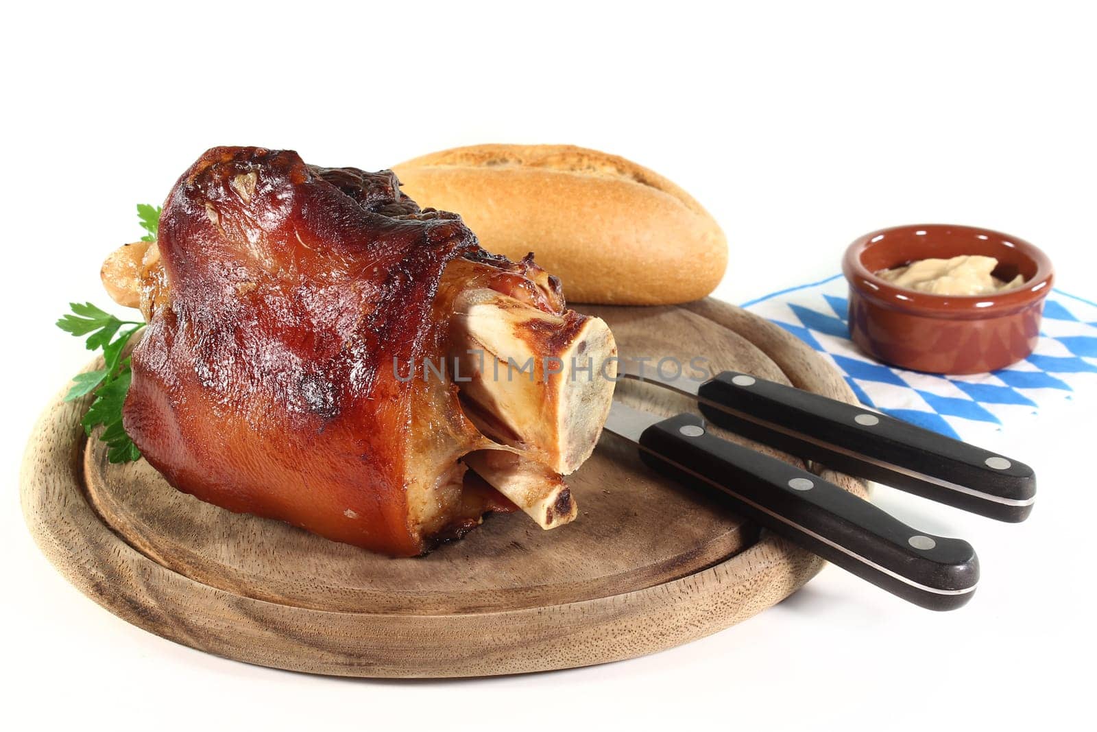 grilled pork knuckle in front of a white background