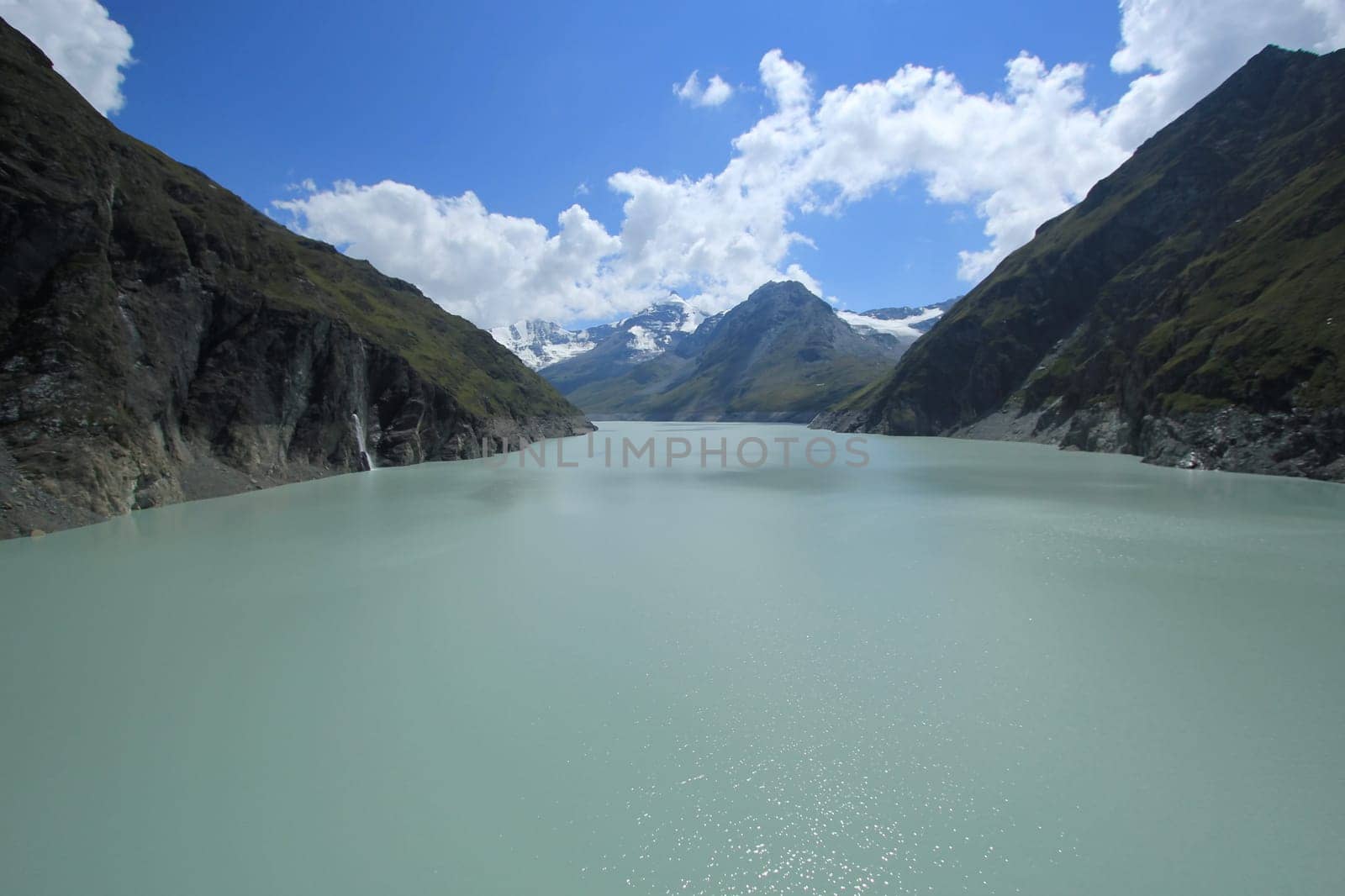 Grande Dixence dam view to alpine landscape on the Lac des Dix lake by little dryness, Switzerland