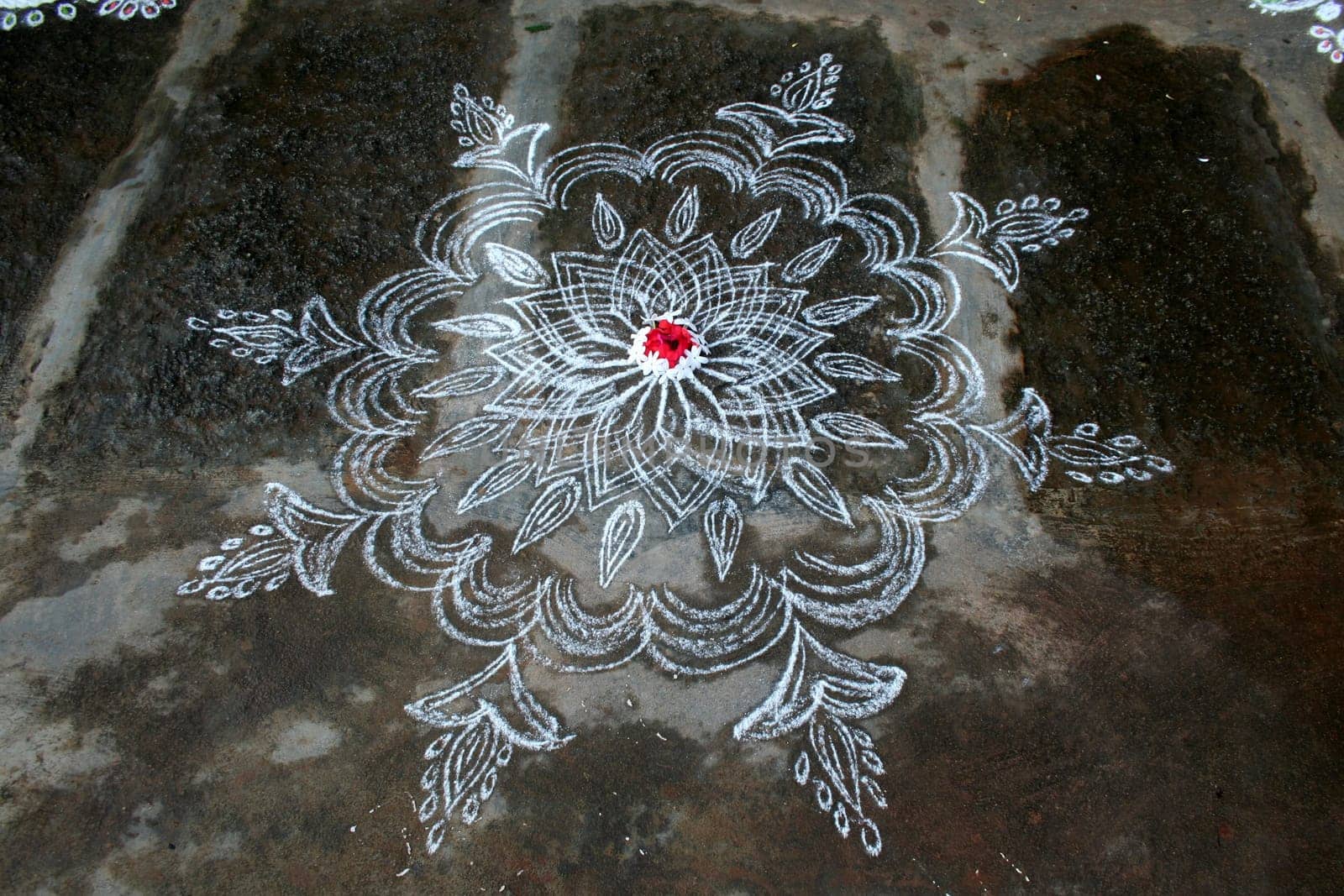 Rangoli is the art of drawing designs using stone powder