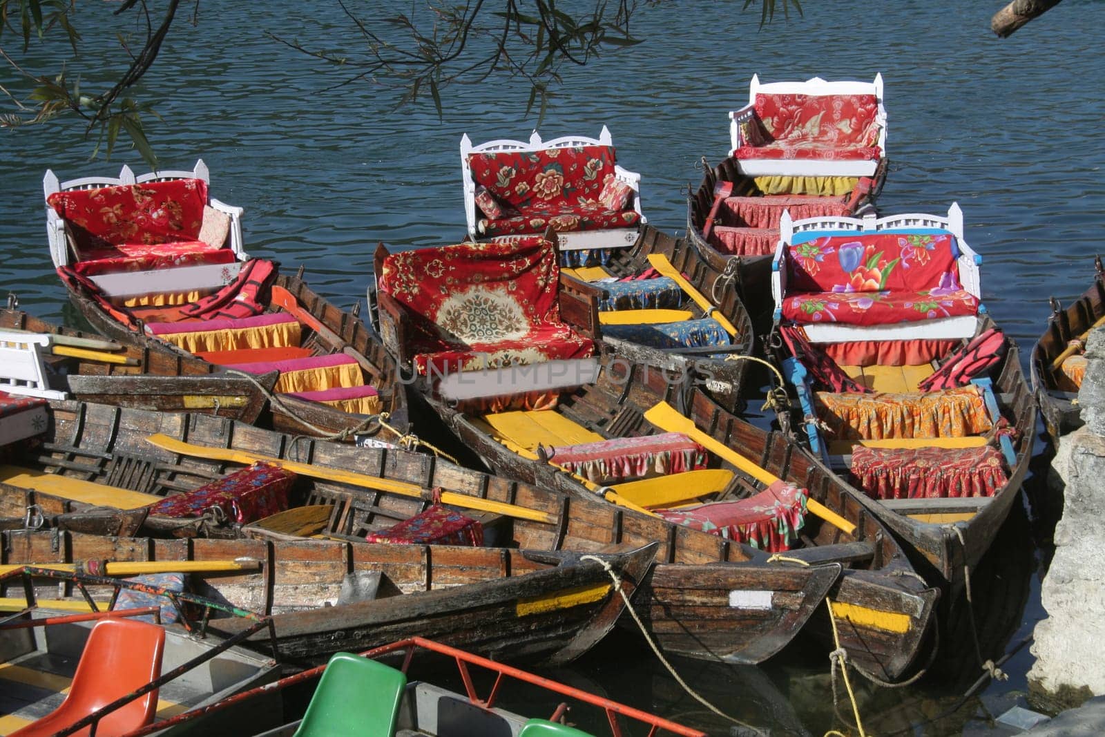 Brilliantly coloured/ colored boats stalked at shore Uploaded on 25aug11