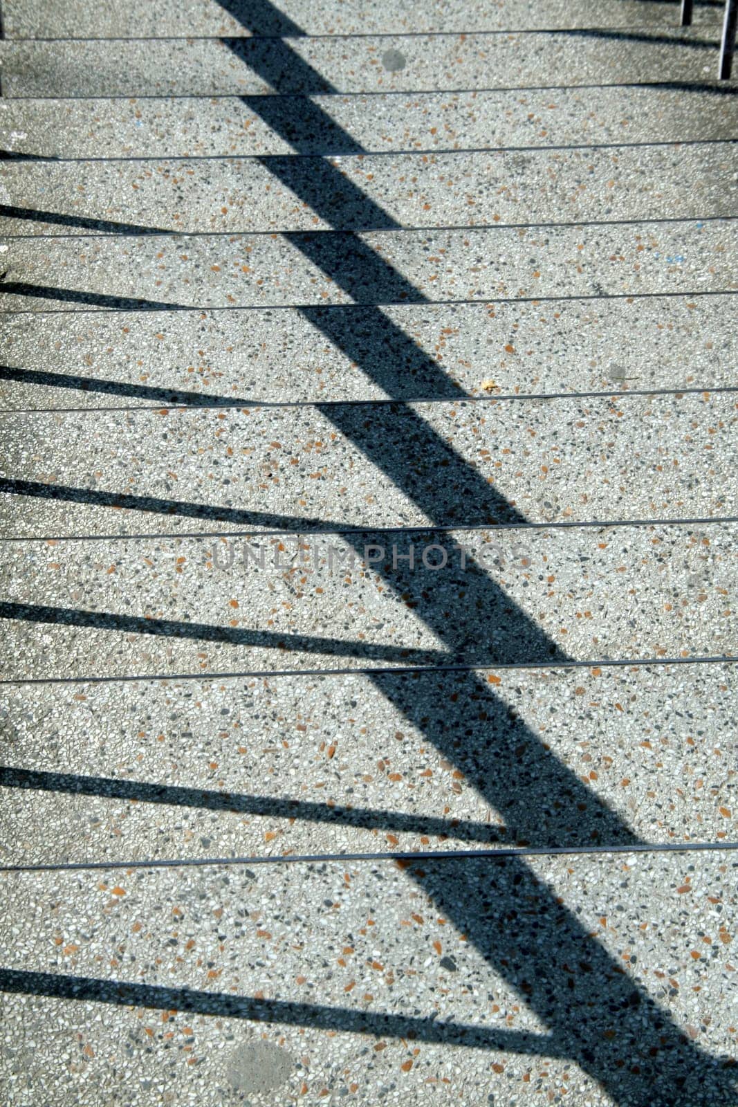 Zigzag pattern of shadow on bright, mosaic steps