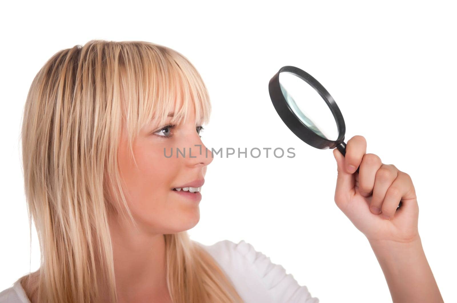 Blonde young woman with magnifying glass