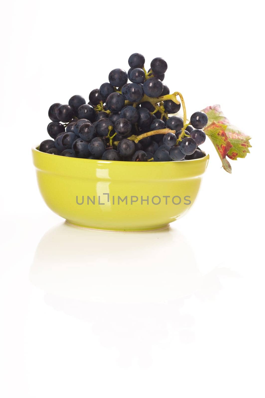 red grapes in green porcelain bowl