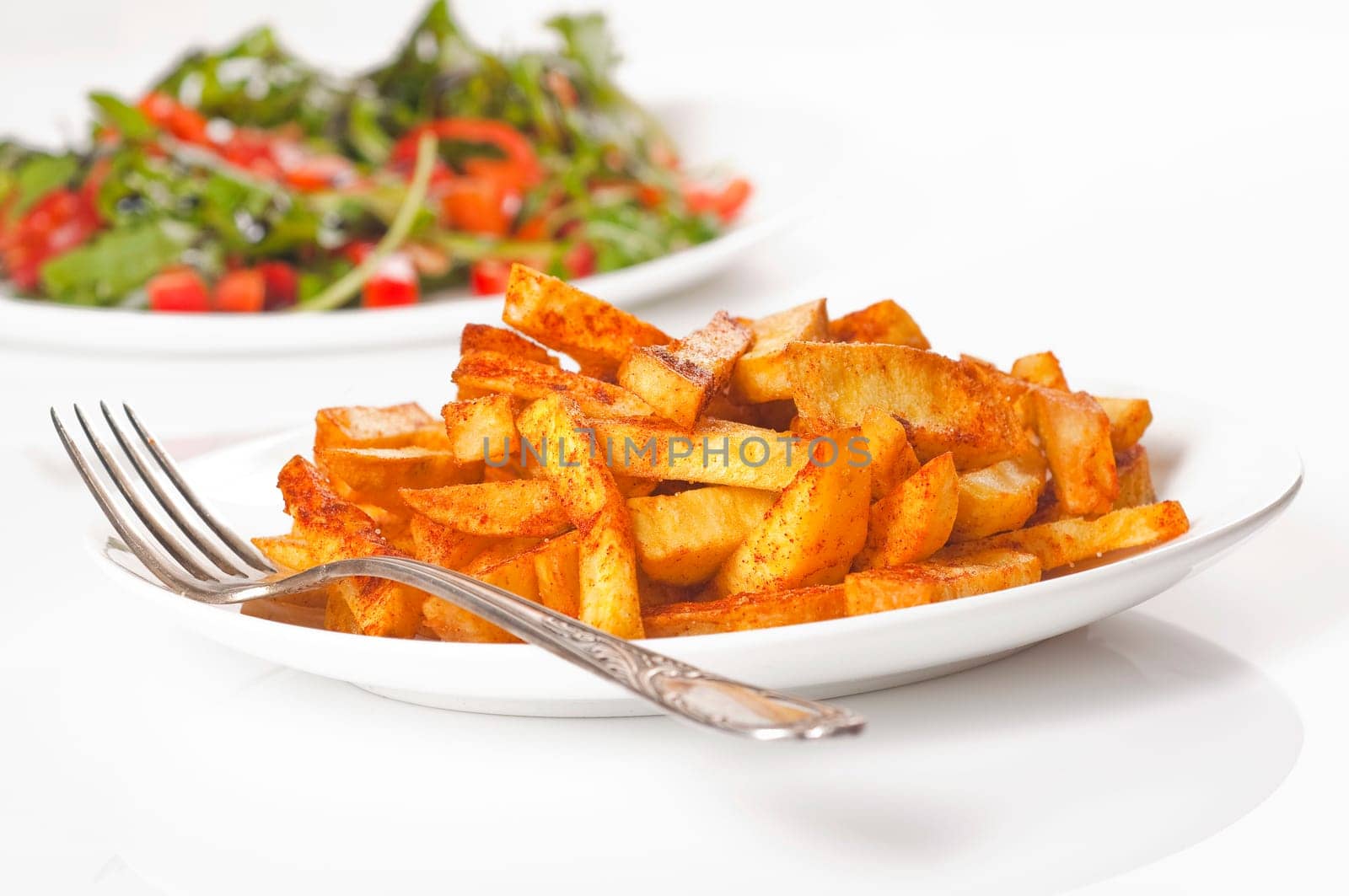homemade French fries with salad
